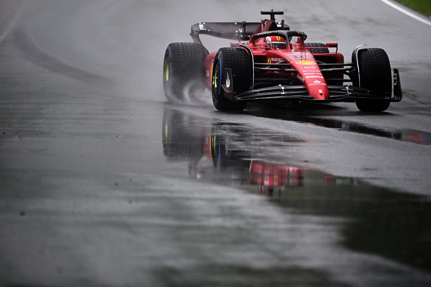 MONTREAL, QUEBEC - JUNE 18: Charles Leclerc of Monaco driving the (16) Ferrari F1-75 in the wet