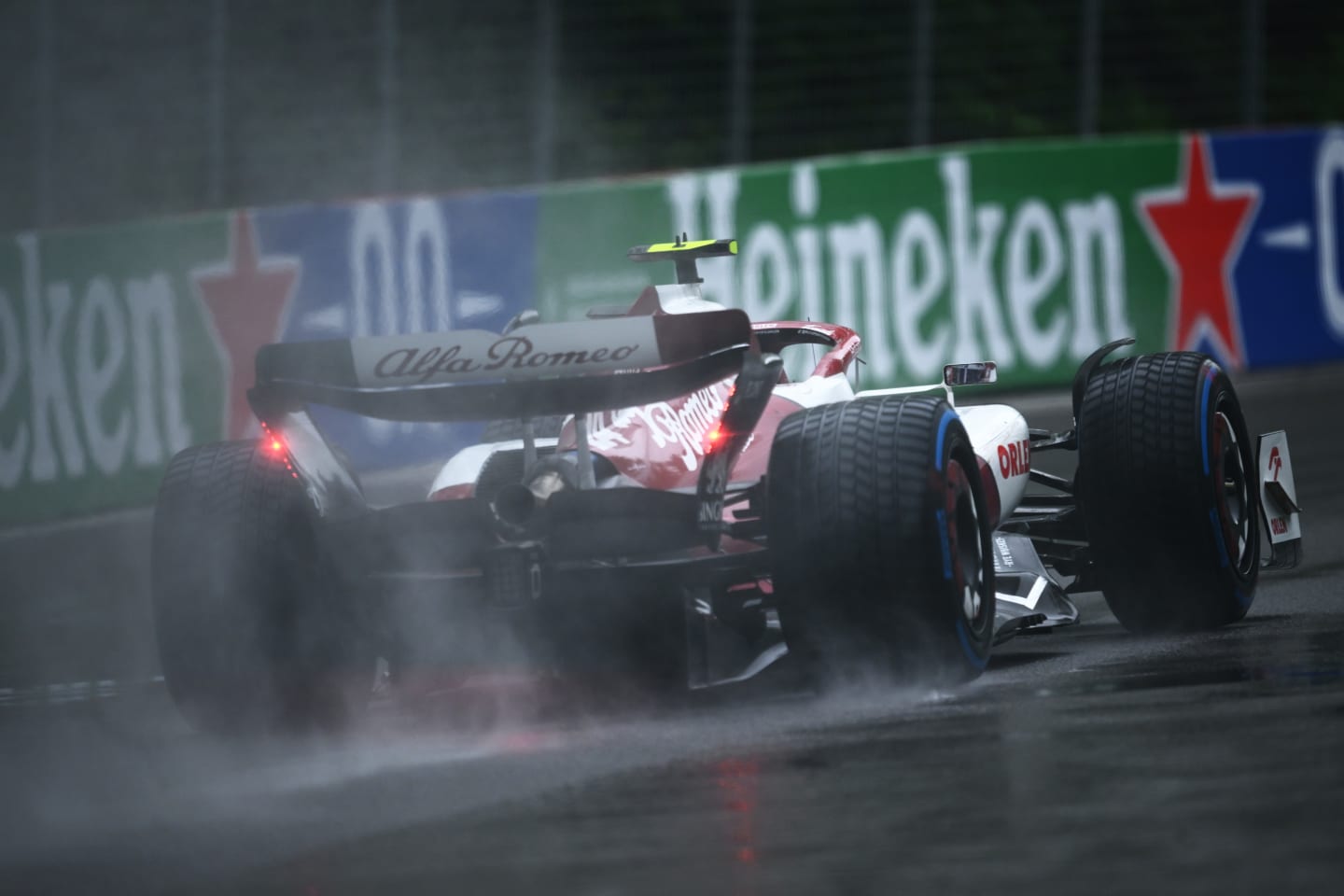 MONTREAL, QUEBEC - JUNE 18: Zhou Guanyu of China driving the (24) Alfa Romeo F1 C42 Ferrari in the wet during qualifying ahead of the F1 Grand Prix of Canada at Circuit Gilles Villeneuve on June 18, 2022 in Montreal, Quebec. (Photo by Clive Mason/Getty Images)