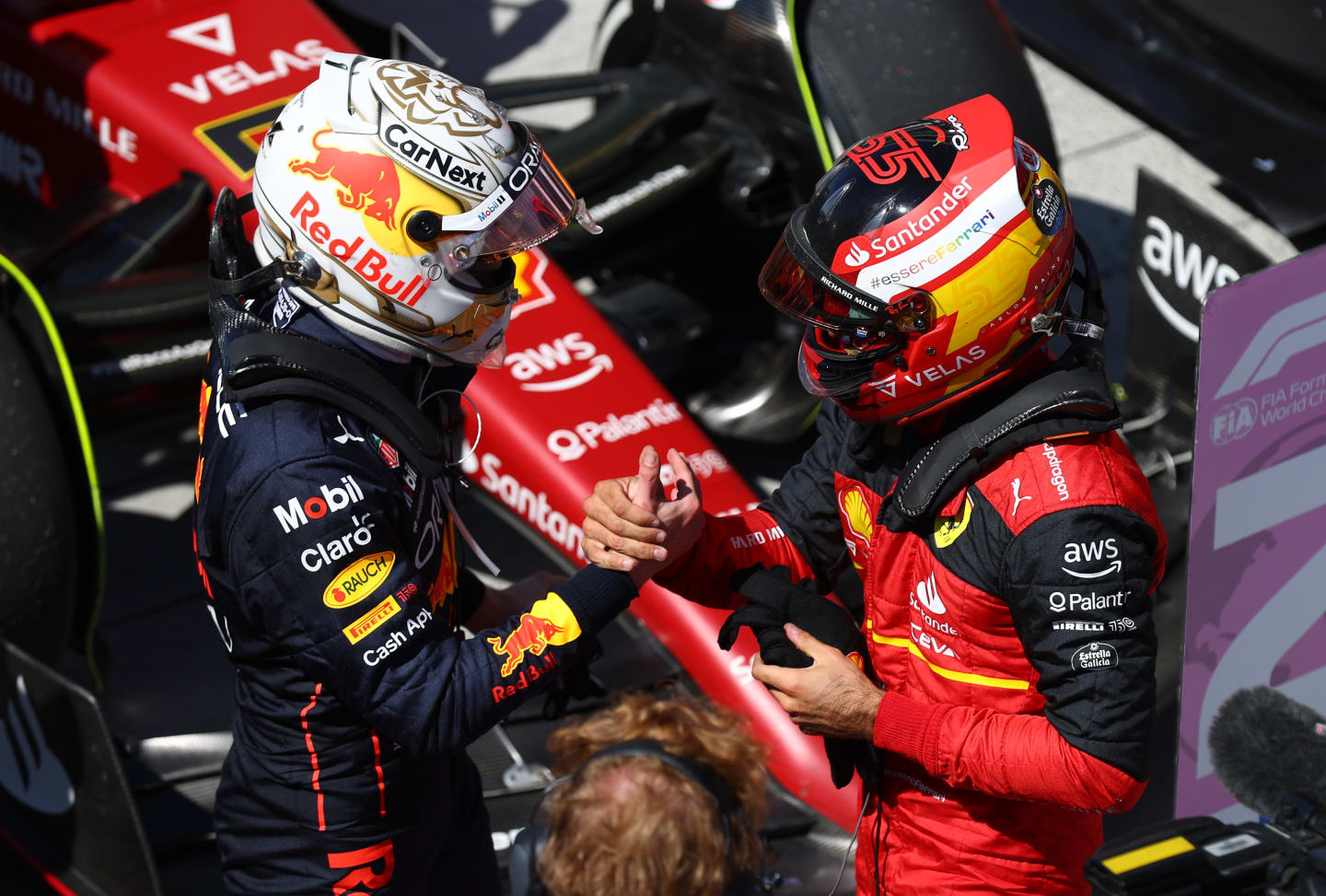 MONTREAL, QUEBEC - JUNE 19: Race winner Max Verstappen of the Netherlands and Oracle Red Bull Racing talks with Second placed Carlos Sainz of Spain and Ferrari in parc ferme during the F1 Grand Prix of Canada at Circuit Gilles Villeneuve on June 19, 2022 in Montreal, Quebec. (Photo by Clive Rose/Getty Images)