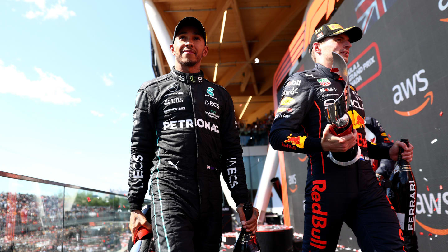 MONTREAL, QUEBEC - JUNE 19: Race winner Max Verstappen of the Netherlands and Oracle Red Bull Racing and Third placed Lewis Hamilton of Great Britain and Mercedes celebrate on the podium during the F1 Grand Prix of Canada at Circuit Gilles Villeneuve on June 19, 2022 in Montreal, Quebec. (Photo by Dan Istitene - Formula 1/Formula 1 via Getty Images)