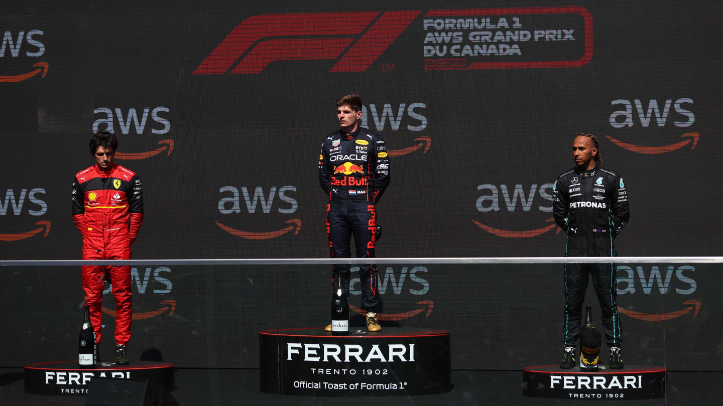 MONTREAL, QUEBEC - JUNE 19: Race winner Max Verstappen of the Netherlands and Oracle Red Bull Racing (C), Second placed Carlos Sainz of Spain and Ferrari (L) and Third placed Lewis Hamilton of Great Britain and Mercedes (R) celebrate on the podium during the F1 Grand Prix of Canada at Circuit Gilles Villeneuve on June 19, 2022 in Montreal, Quebec. (Photo by Lars Baron - Formula 1/Formula 1 via Getty Images)