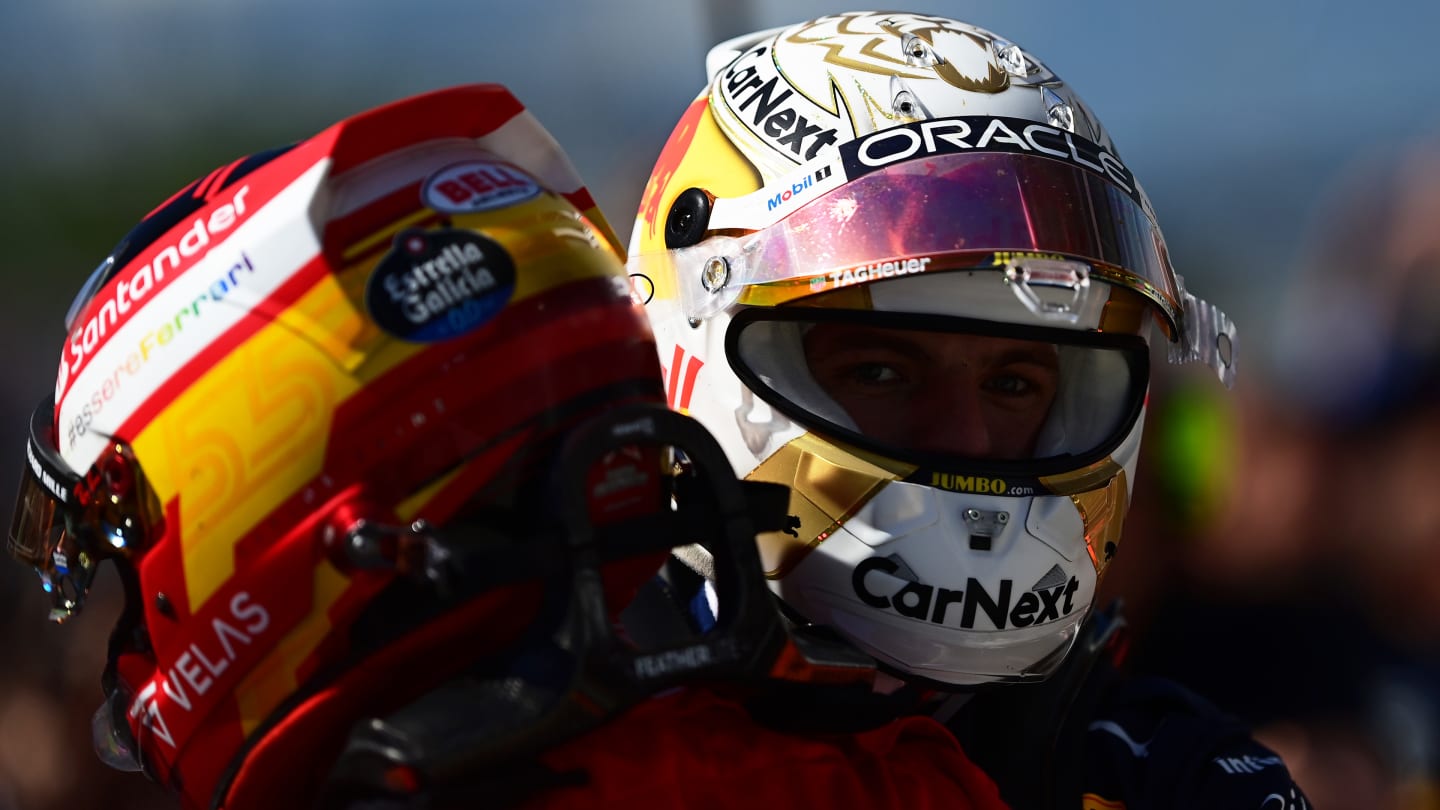 MONTREAL, QUEBEC - JUNE 19: Race winner Max Verstappen of the Netherlands and Oracle Red Bull Racing talks with Second placed Carlos Sainz of Spain and Ferrari in parc ferme during the F1 Grand Prix of Canada at Circuit Gilles Villeneuve on June 19, 2022 in Montreal, Quebec. (Photo by Mario Renzi - Formula 1/Formula 1 via Getty Images)