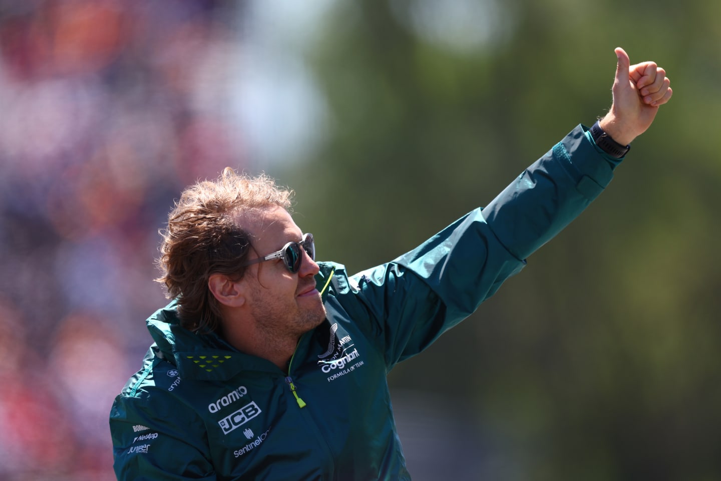 MONTREAL, QUEBEC - JUNE 19: Sebastian Vettel of Germany and Aston Martin F1 Team waves to the crowd from the drivers parade ahead of the F1 Grand Prix of Canada at Circuit Gilles Villeneuve on June 19, 2022 in Montreal, Quebec. (Photo by Clive Rose/Getty Images)
