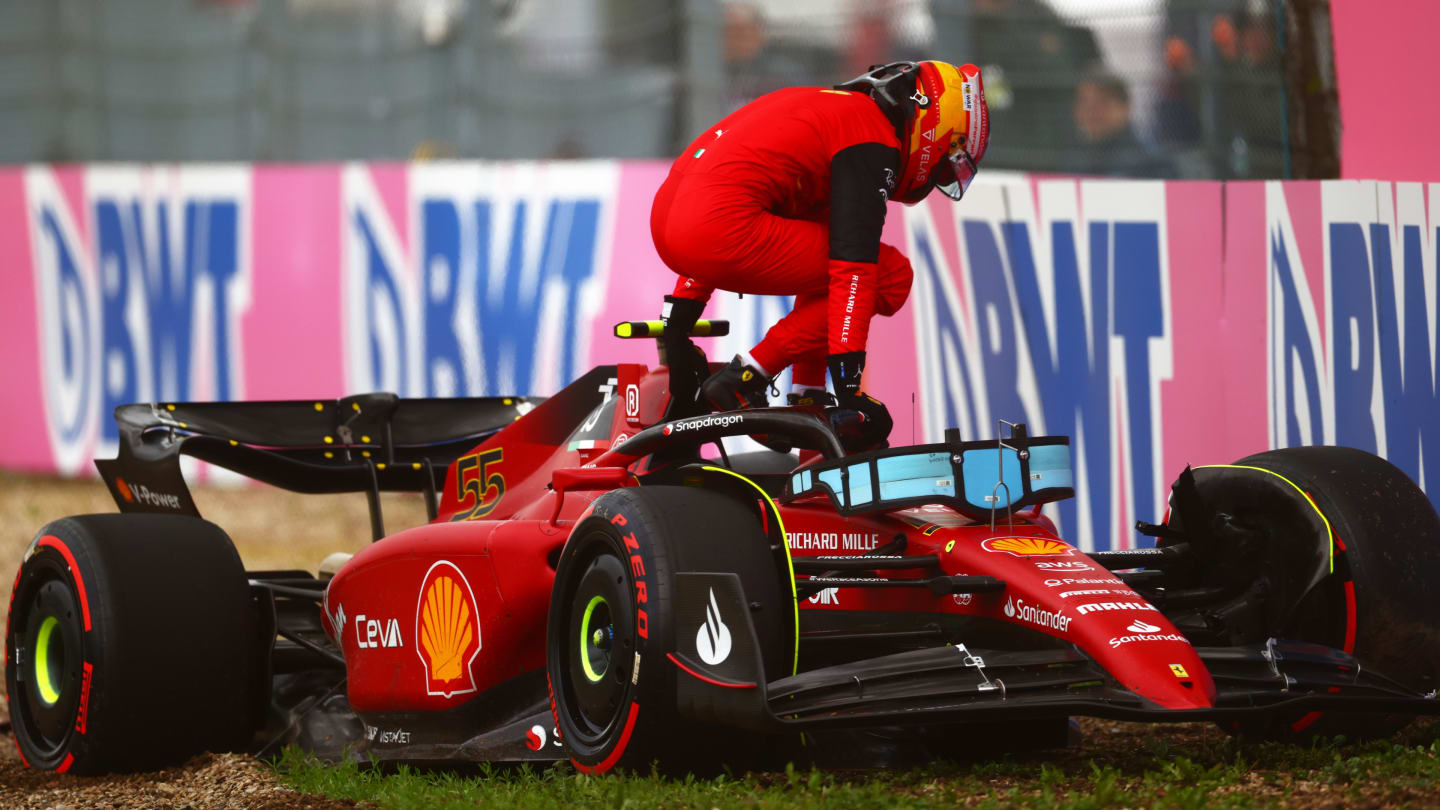 IMOLA, ITALY - APRIL 22: Carlos Sainz of Spain and Ferrari climbs from his car after crashing during qualifying ahead of the F1 Grand Prix of Emilia Romagna at Autodromo Enzo e Dino Ferrari on April 22, 2022 in Imola, Italy. (Photo by Dan Istitene - Formula 1/Formula 1 via Getty Images)