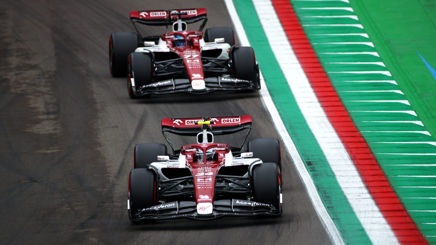 IMOLA, ITALY - APRIL 22: Zhou Guanyu of China driving the (24) Alfa Romeo F1 C42 Ferrari leads Valtteri Bottas of Finland driving the (77) Alfa Romeo F1 C42 Ferrari  during qualifying ahead of the F1 Grand Prix of Emilia Romagna at Autodromo Enzo e Dino Ferrari on April 22, 2022 in Imola, Italy. (Photo by Joe Portlock - Formula 1/Formula 1 via Getty Images)