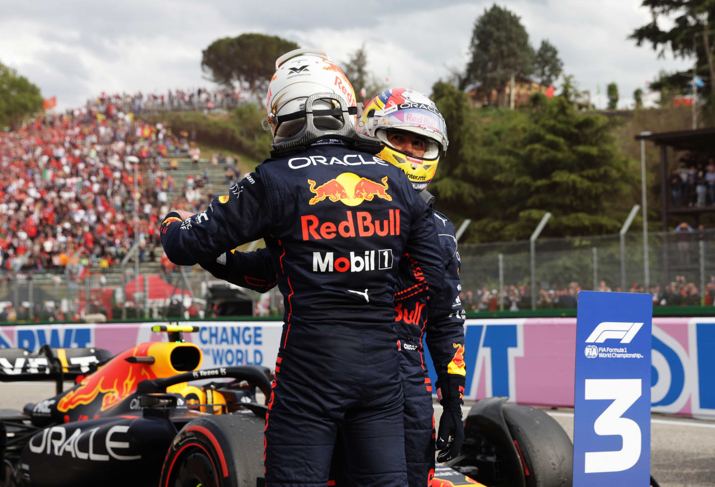 IMOLA, ITALY - APRIL 23: Sprint winner Max Verstappen of the Netherlands and Oracle Red Bull Racing and Third placed Sergio Perez of Mexico and Oracle Red Bull Racing hug in parc ferme during Sprint ahead of the F1 Grand Prix of Emilia Romagna at Autodromo Enzo e Dino Ferrari on April 23, 2022 in Imola, Italy. (Photo by Mark Thompson/Getty Images)