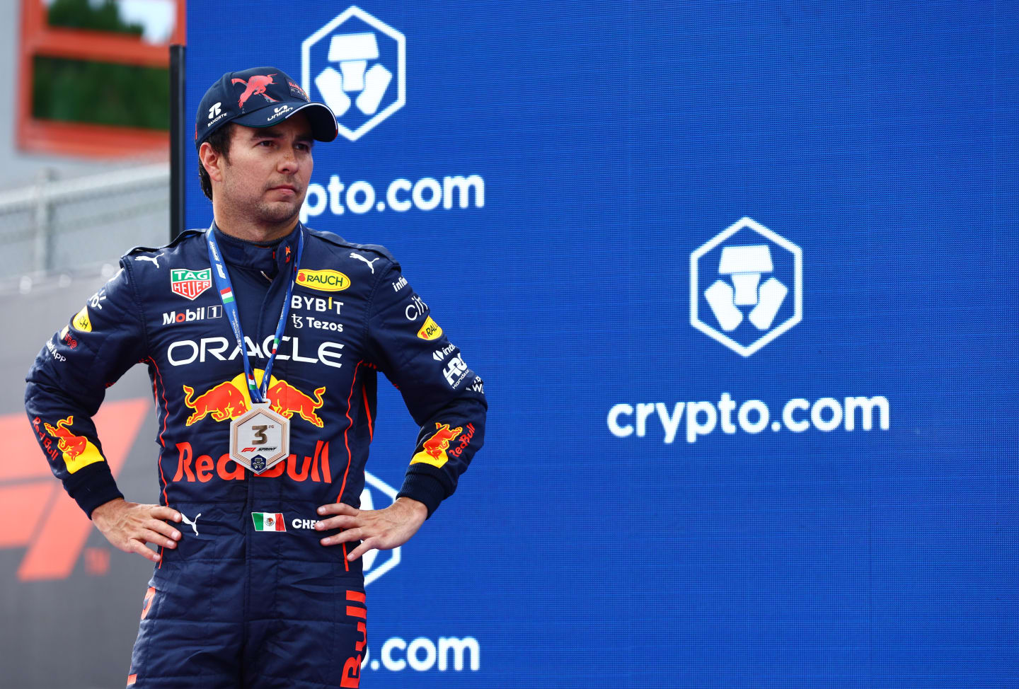 IMOLA, ITALY - APRIL 23: Third placed Sergio Perez of Mexico and Oracle Red Bull Racing looks on at the Sprint Victory Ceremony during Sprint ahead of the F1 Grand Prix of Emilia Romagna at Autodromo Enzo e Dino Ferrari on April 23, 2022 in Imola, Italy. (Photo by Mark Thompson/Getty Images)