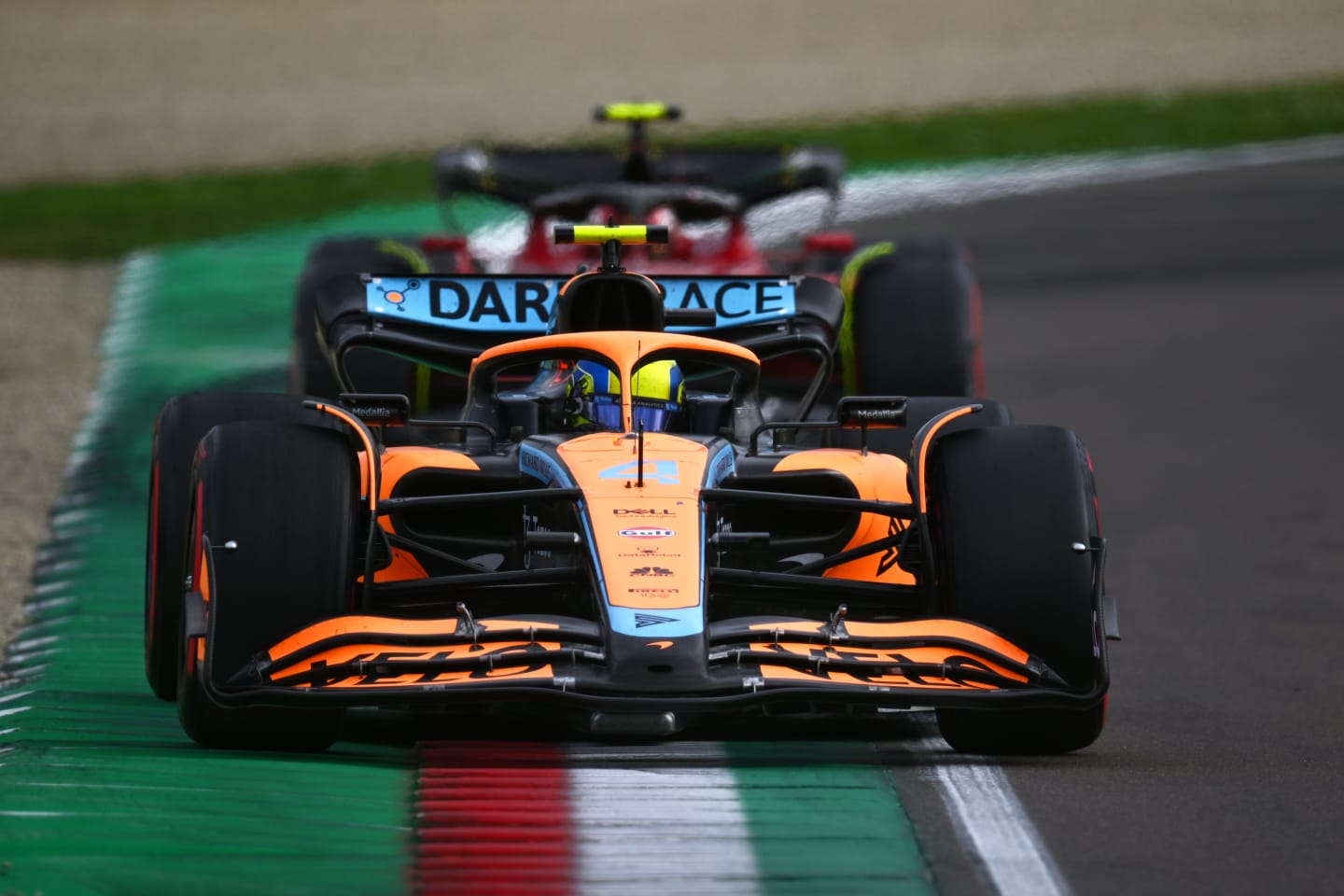 IMOLA, ITALY - APRIL 23: Lando Norris of Great Britain driving the (4) McLaren MCL36 Mercedes leads Carlos Sainz of Spain driving (55) the Ferrari F1-75 during Sprint ahead of the F1 Grand Prix of Emilia Romagna at Autodromo Enzo e Dino Ferrari on April 23, 2022 in Imola, Italy. (Photo by Clive Mason/Getty Images)