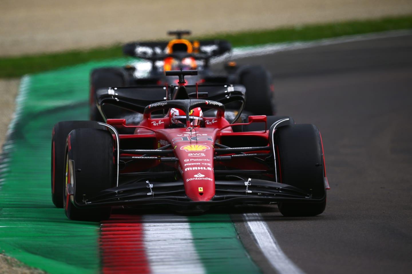 IMOLA, ITALY - APRIL 23: Charles Leclerc of Monaco driving (16) the Ferrari F1-75 leads Max Verstappen of the Netherlands driving the (1) Oracle Red Bull Racing RB18 on track during Sprint ahead of the F1 Grand Prix of Emilia Romagna at Autodromo Enzo e Dino Ferrari on April 23, 2022 in Imola, Italy. (Photo by Clive Mason/Getty Images)
