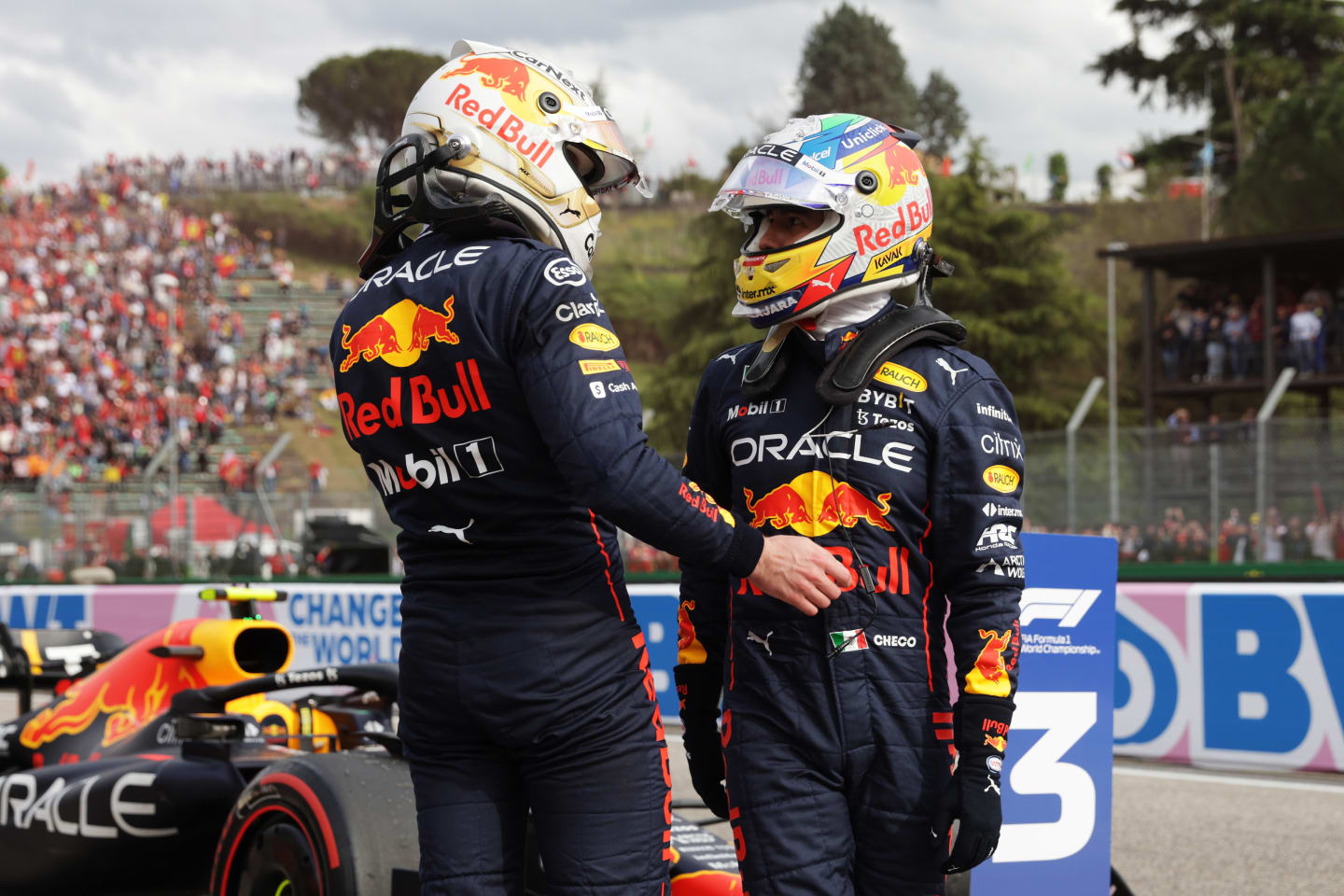 IMOLA, ITALY - APRIL 23: Sprint winner Max Verstappen of the Netherlands and Oracle Red Bull Racing and Third placed Sergio Perez of Mexico and Oracle Red Bull Racing talk in parc ferme during Sprint ahead of the F1 Grand Prix of Emilia Romagna at Autodromo Enzo e Dino Ferrari on April 23, 2022 in Imola, Italy. (Photo by Mark Thompson/Getty Images)