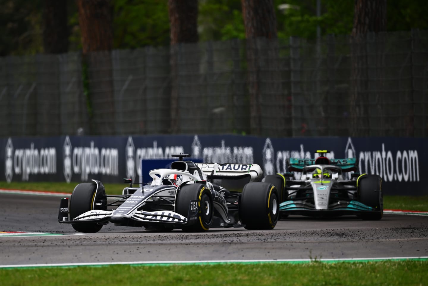 IMOLA, ITALY - APRIL 24: Pierre Gasly of France driving the (10) Scuderia AlphaTauri AT03 leads Lewis Hamilton of Great Britain driving the (44) Mercedes AMG Petronas F1 Team W13 during the F1 Grand Prix of Emilia Romagna at Autodromo Enzo e Dino Ferrari on April 24, 2022 in Imola, Italy. (Photo by Clive Mason/Getty Images)