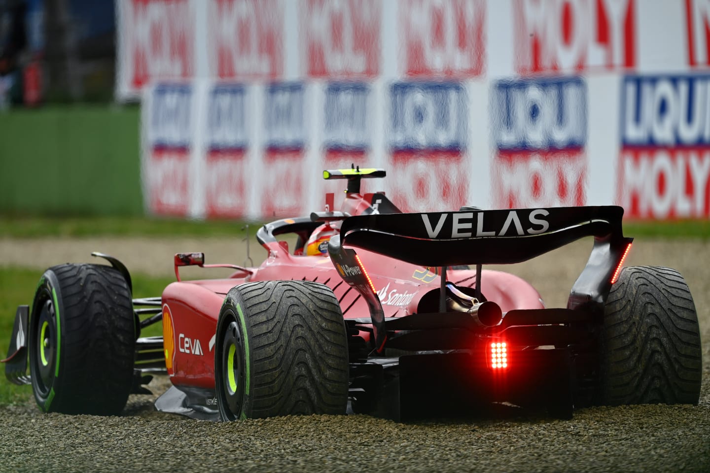 IMOLA, ITALY - APRIL 24: Carlos Sainz of Spain driving (55) the Ferrari F1-75 gets stuck in the
