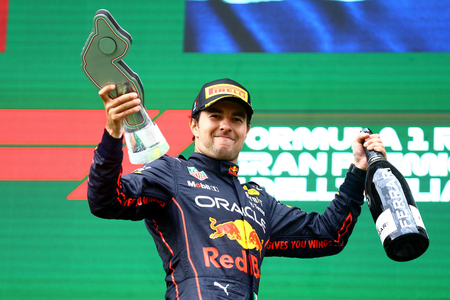 IMOLA, ITALY - APRIL 24: Second placed Sergio Perez of Mexico and Oracle Red Bull Racing celebrates on the podium during the F1 Grand Prix of Emilia Romagna at Autodromo Enzo e Dino Ferrari on April 24, 2022 in Imola, Italy. (Photo by Mark Thompson/Getty Images)