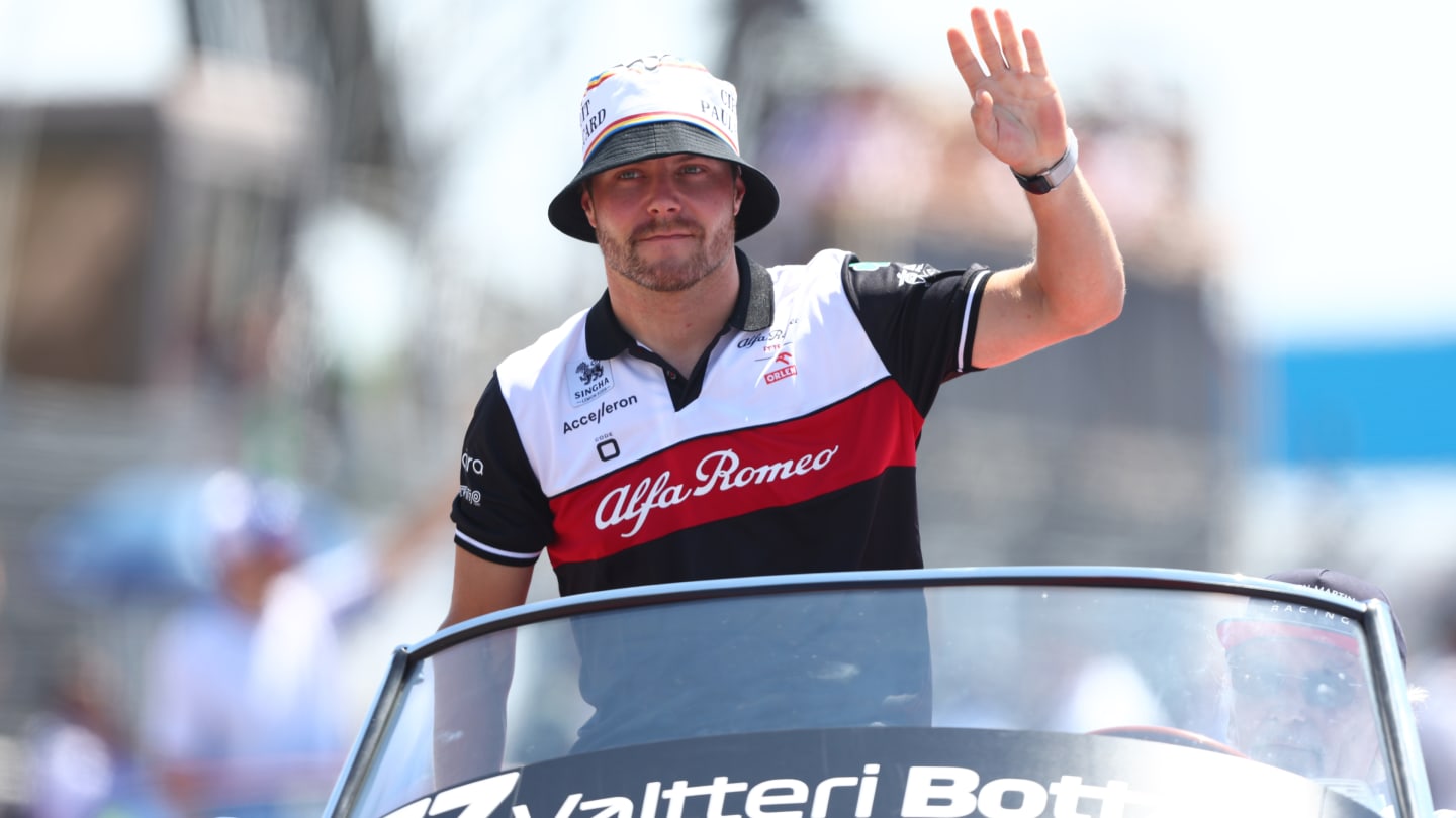 LE CASTELLET, FRANCE - JULY 24: Valtteri Bottas of Finland and Alfa Romeo F1 waves to the crowd on the drivers parade ahead of the F1 Grand Prix of France at Circuit Paul Ricard on July 24, 2022 in Le Castellet, France. (Photo by Bryn Lennon - Formula 1/Formula 1 via Getty Images)