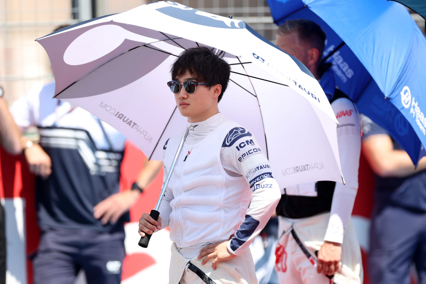 LE CASTELLET, FRANCE - JULY 24: Yuki Tsunoda of Japan and Scuderia AlphaTauri stands for the national anthem on the grid during the F1 Grand Prix of France at Circuit Paul Ricard on July 24, 2022 in Le Castellet, France. (Photo by Peter Fox/Getty Images)