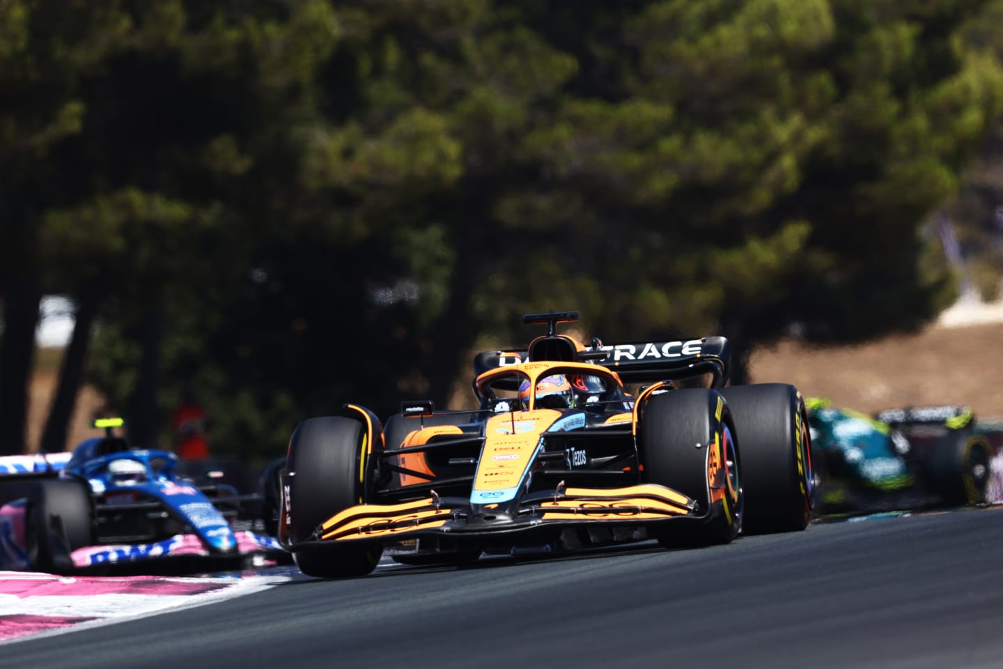 LE CASTELLET, FRANCE - JULY 24: Daniel Ricciardo of Australia driving the (3) McLaren MCL36 Mercedes leads Esteban Ocon of France driving the (31) Alpine F1 A522 Renault on track during the F1 Grand Prix of France at Circuit Paul Ricard on July 24, 2022 in Le Castellet, France. (Photo by Clive Rose/Getty Images)