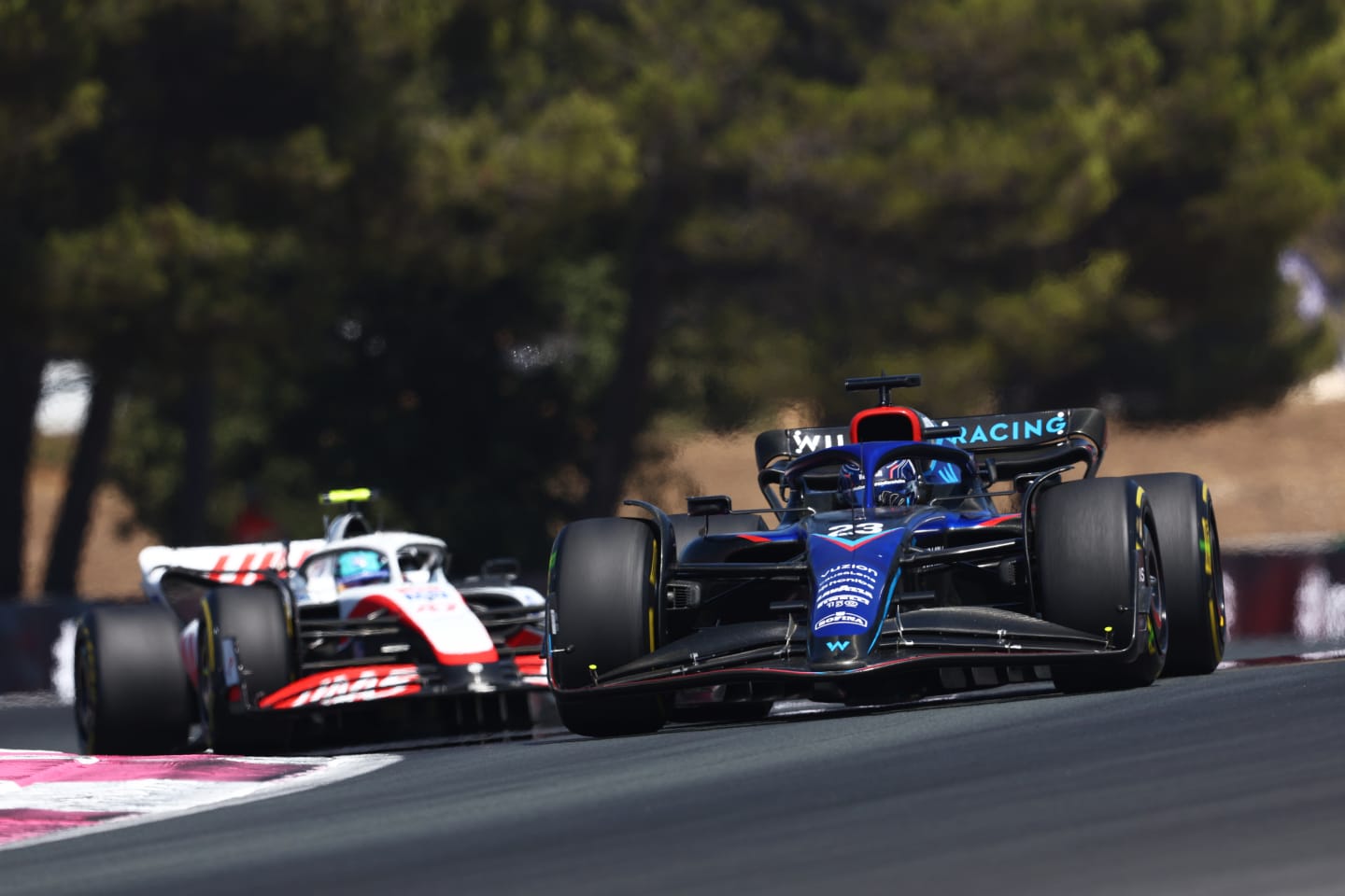 LE CASTELLET, FRANCE - JULY 24: Alexander Albon of Thailand driving the (23) Williams FW44 Mercedes leads Mick Schumacher of Germany driving the (47) Haas F1 VF-22 Ferrari during the F1 Grand Prix of France at Circuit Paul Ricard on July 24, 2022 in Le Castellet, France. (Photo by Clive Rose/Getty Images)