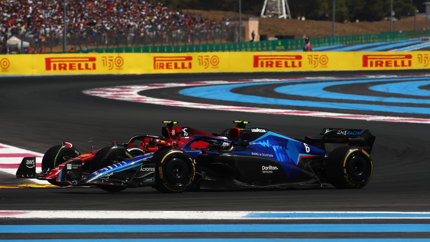 LE CASTELLET, FRANCE - JULY 24: Nicholas Latifi of Canada driving the (6) Williams FW44 Mercedes and Carlos Sainz of Spain driving (55) the Ferrari F1-75 battle for track position during the F1 Grand Prix of France at Circuit Paul Ricard on July 24, 2022 in Le Castellet, France. (Photo by Joe Portlock - Formula 1/Formula 1 via Getty Images)