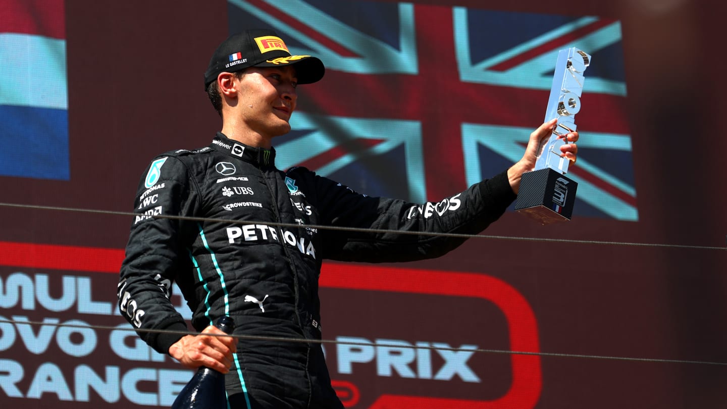 LE CASTELLET, FRANCE - JULY 24: Third placed George Russell of Great Britain and Mercedes celebrates on the podium during the F1 Grand Prix of France at Circuit Paul Ricard on July 24, 2022 in Le Castellet, France. (Photo by Bryn Lennon - Formula 1/Formula 1 via Getty Images)
