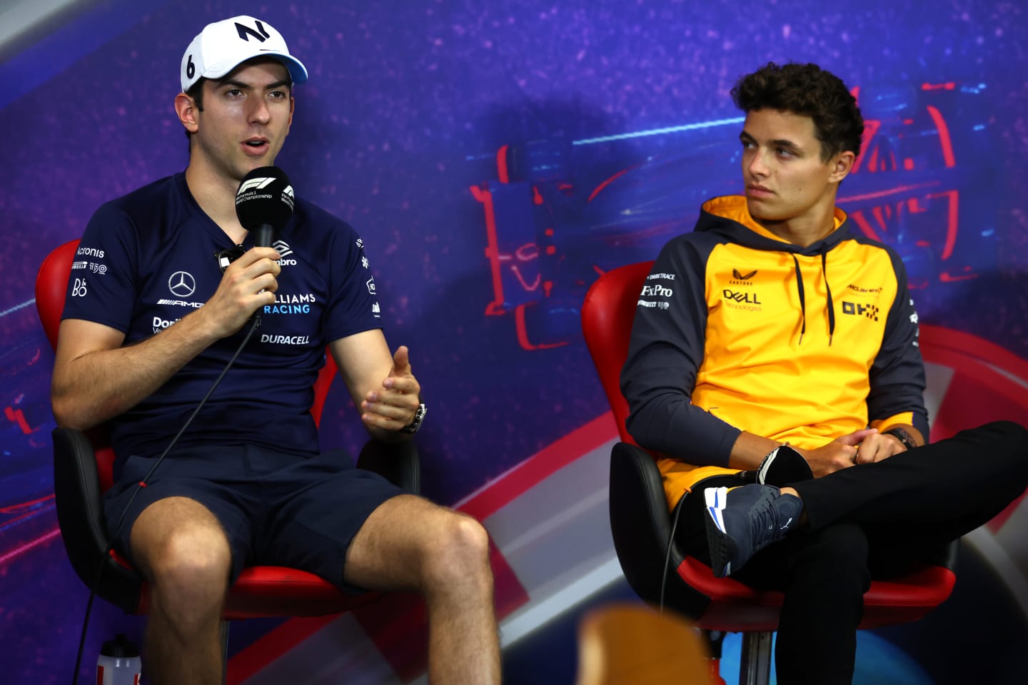 LE CASTELLET, FRANCE - JULY 21: Nicholas Latifi of Canada and Williams and Lando Norris of Great Britain and McLaren talk in the Drivers Press Conference during previews ahead of the F1 Grand Prix of France at Circuit Paul Ricard on July 21, 2022 in Le Castellet, France. (Photo by Bryn Lennon/Getty Images)