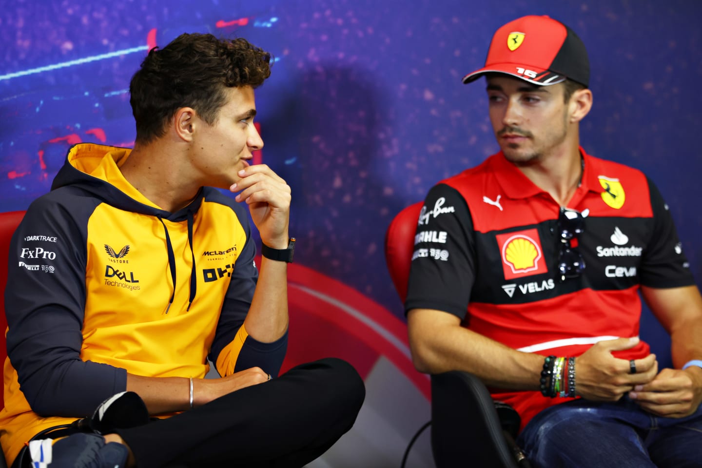 LE CASTELLET, FRANCE - JULY 21: Lando Norris of Great Britain and McLaren and Charles Leclerc of Monaco and Ferrari talk in the Drivers Press Conference during previews ahead of the F1 Grand Prix of France at Circuit Paul Ricard on July 21, 2022 in Le Castellet, France. (Photo by Bryn Lennon/Getty Images)