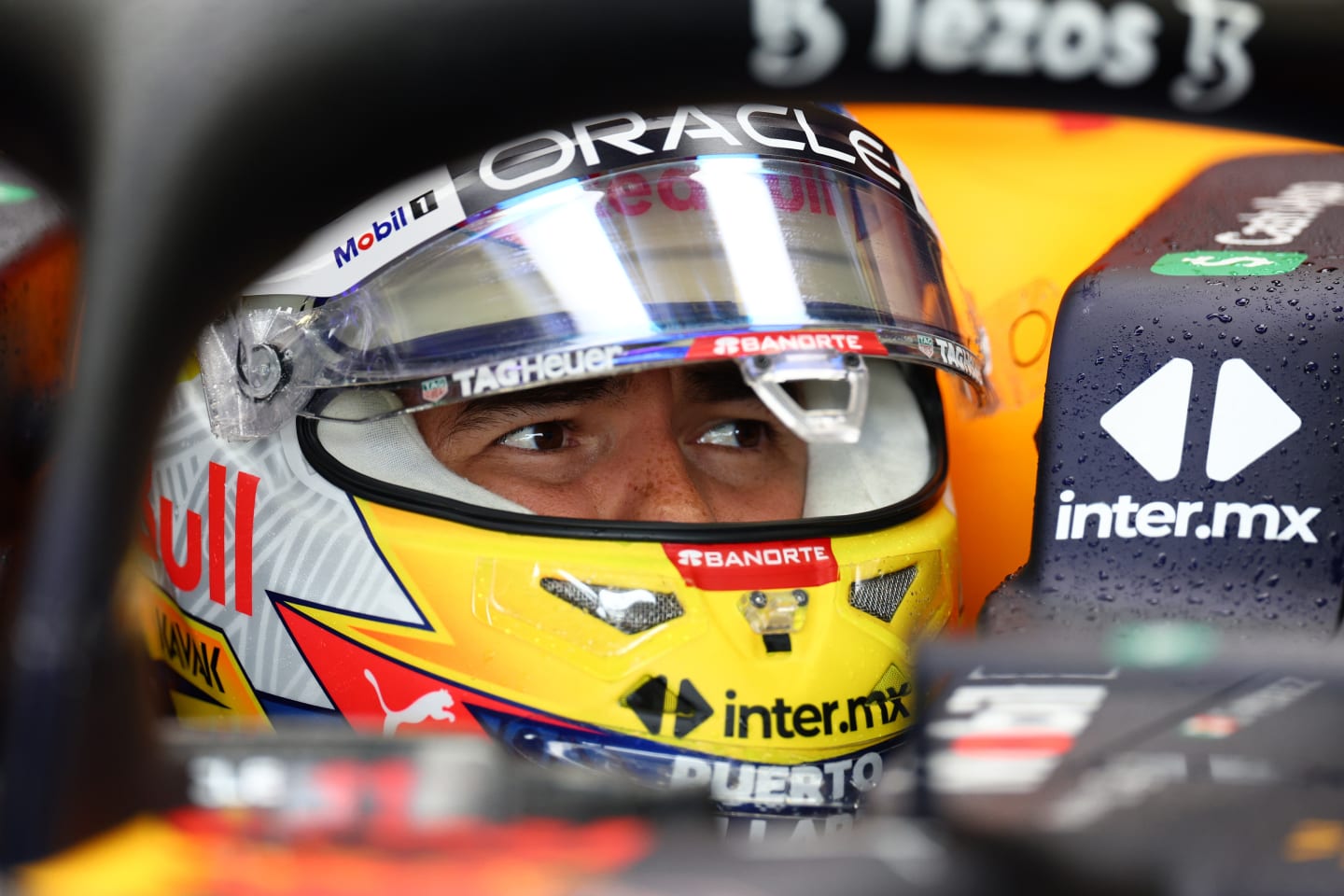NORTHAMPTON, ENGLAND - JULY 01: Sergio Perez of Mexico and Oracle Red Bull Racing prepares to drive in the garage during practice ahead of the F1 Grand Prix of Great Britain at Silverstone on July 01, 2022 in Northampton, England. (Photo by Clive Rose/Getty Images)