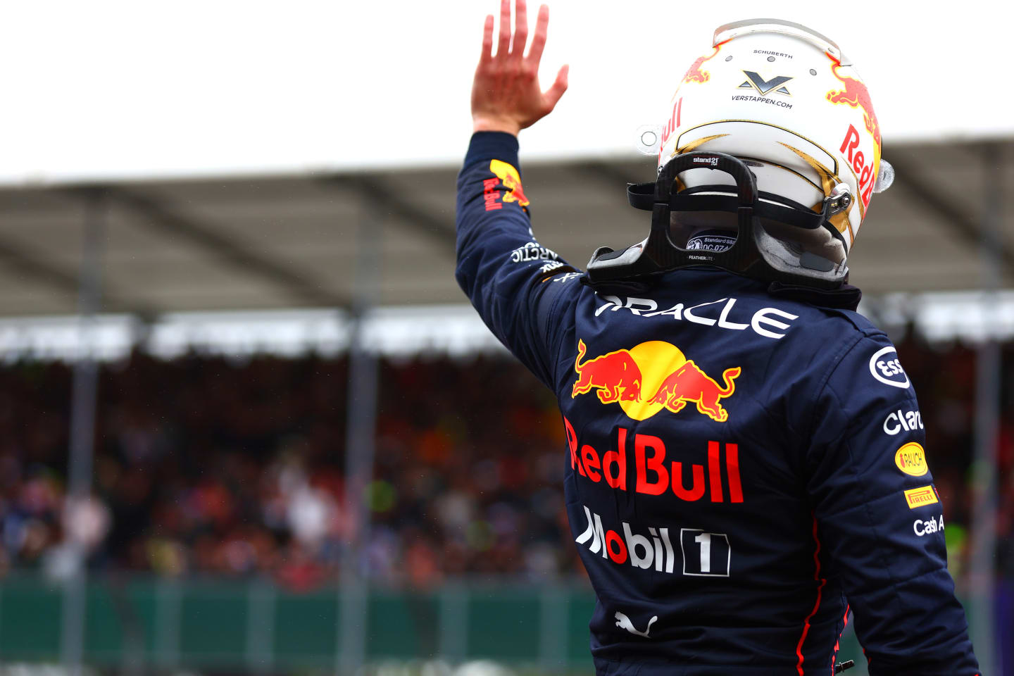 NORTHAMPTON, ENGLAND - JULY 02: Second placed qualifier Max Verstappen of the Netherlands and Oracle Red Bull Racing waves to the crowd in parc ferme during qualifying ahead of the F1 Grand Prix of Great Britain at Silverstone on July 02, 2022 in Northampton, England. (Photo by Mark Thompson/Getty Images)