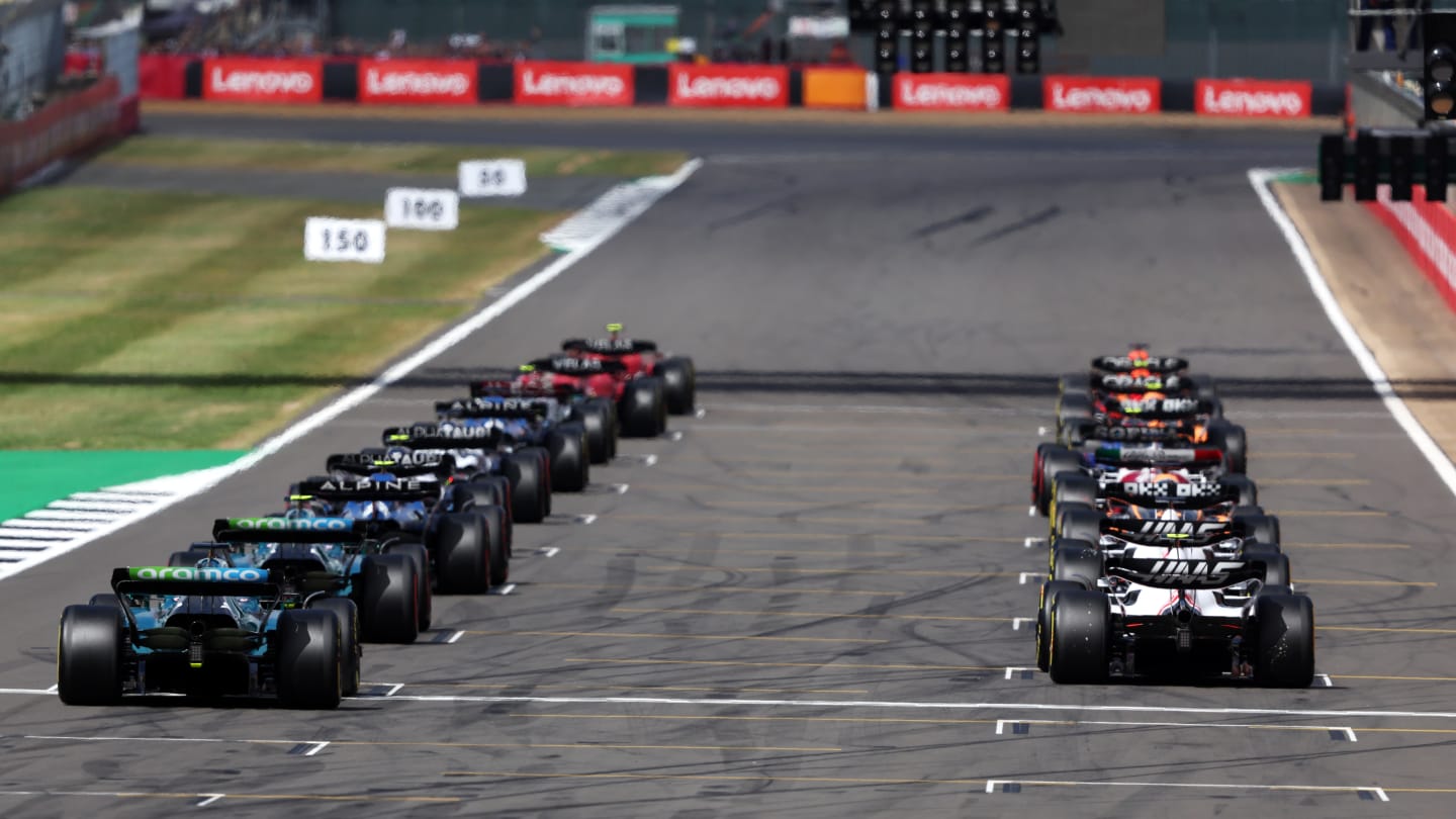 NORTHAMPTON, ENGLAND - JULY 03: The drivers line up on the grid for the start of the F1 Grand Prix