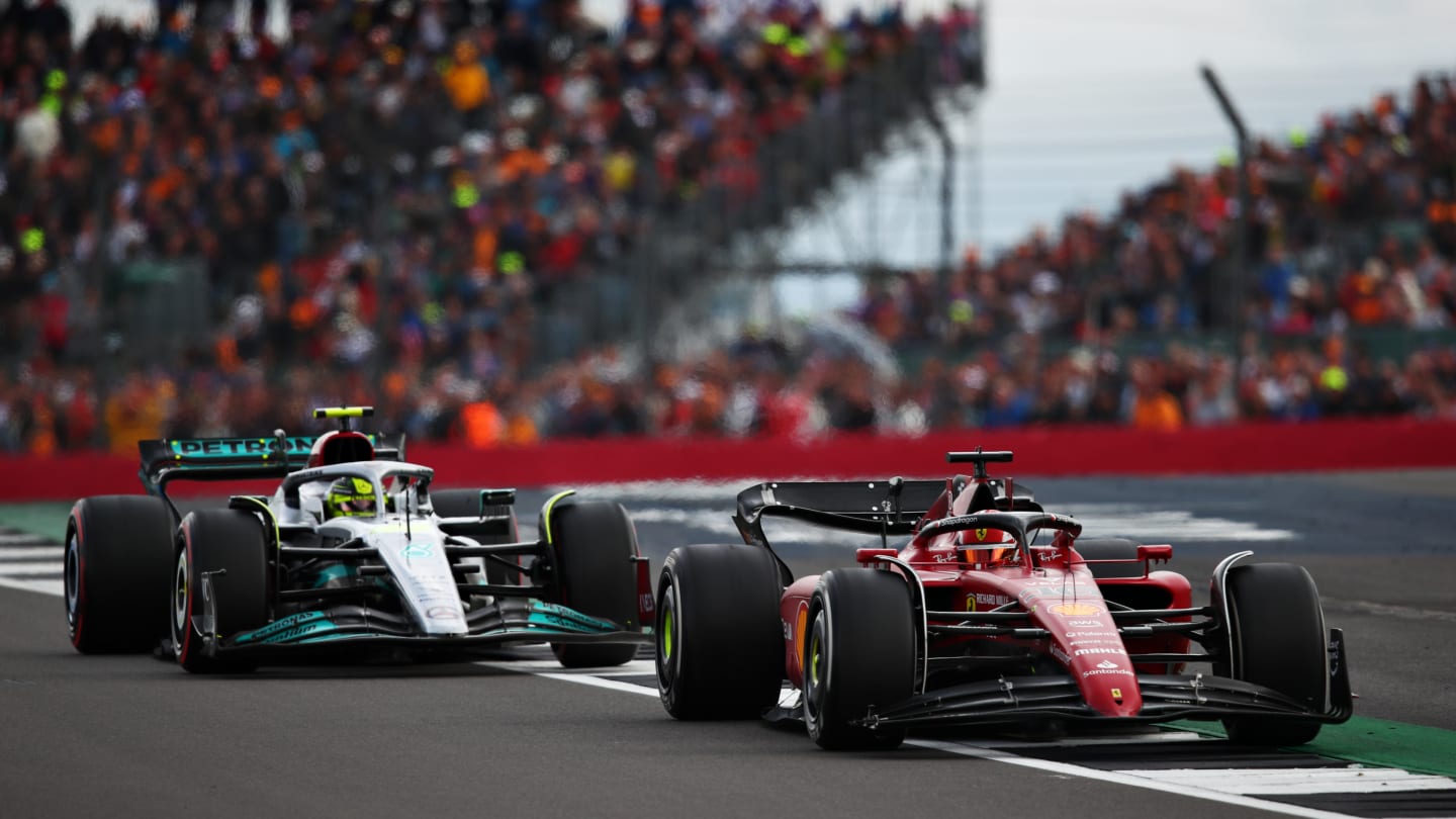 NORTHAMPTON, ENGLAND - JULY 03: Charles Leclerc of Monaco driving the (16) Ferrari F1-75 leads Lewis Hamilton of Great Britain driving the (44) Mercedes AMG Petronas F1 Team W13 during the F1 Grand Prix of Great Britain at Silverstone on July 03, 2022 in Northampton, England. (Photo by Joe Portlock - Formula 1/Formula 1 via Getty Images)