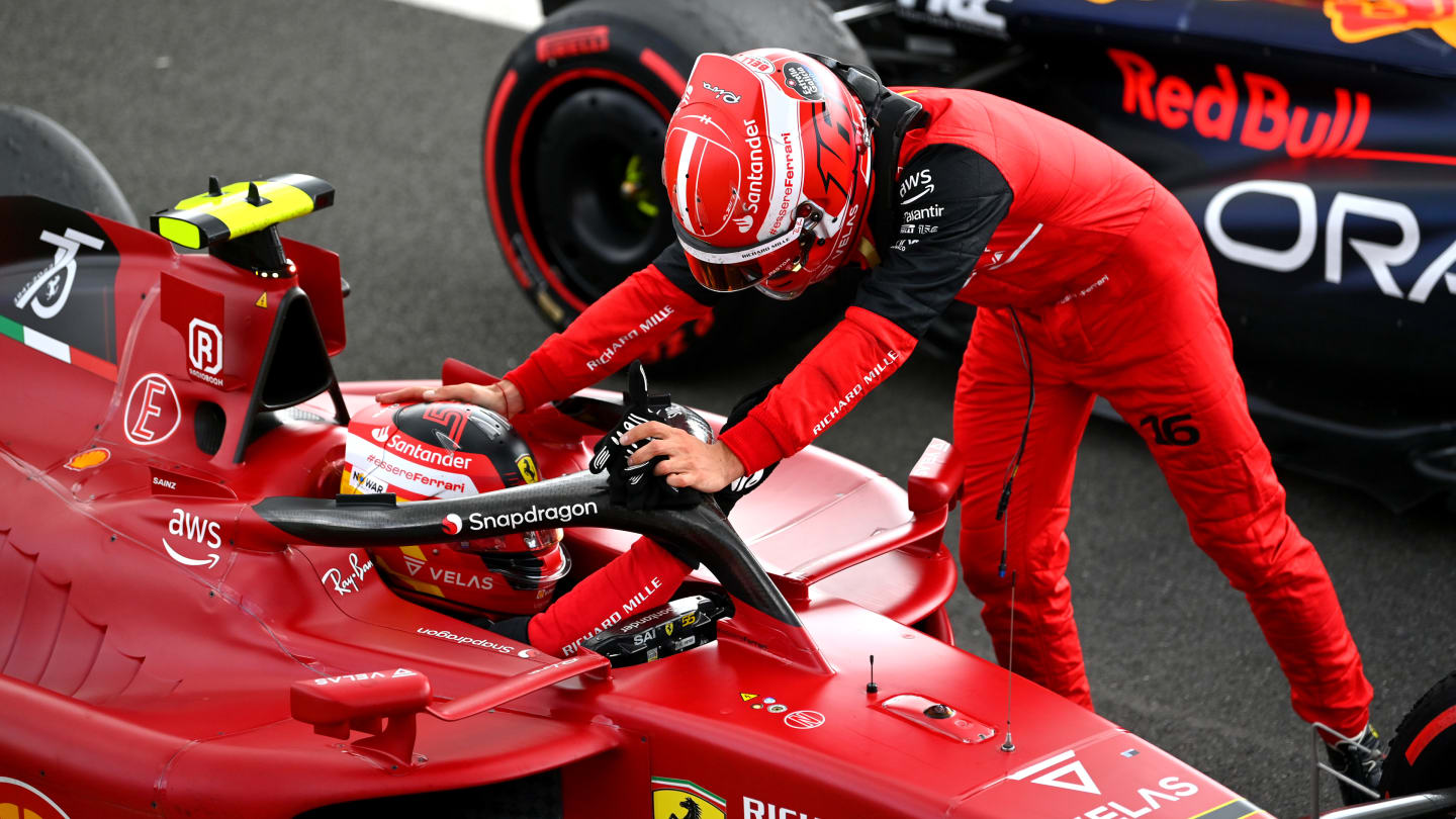 NORTHAMPTON, ENGLAND - JULY 03: Race winner Carlos Sainz of Spain and Ferrari is congratulated by