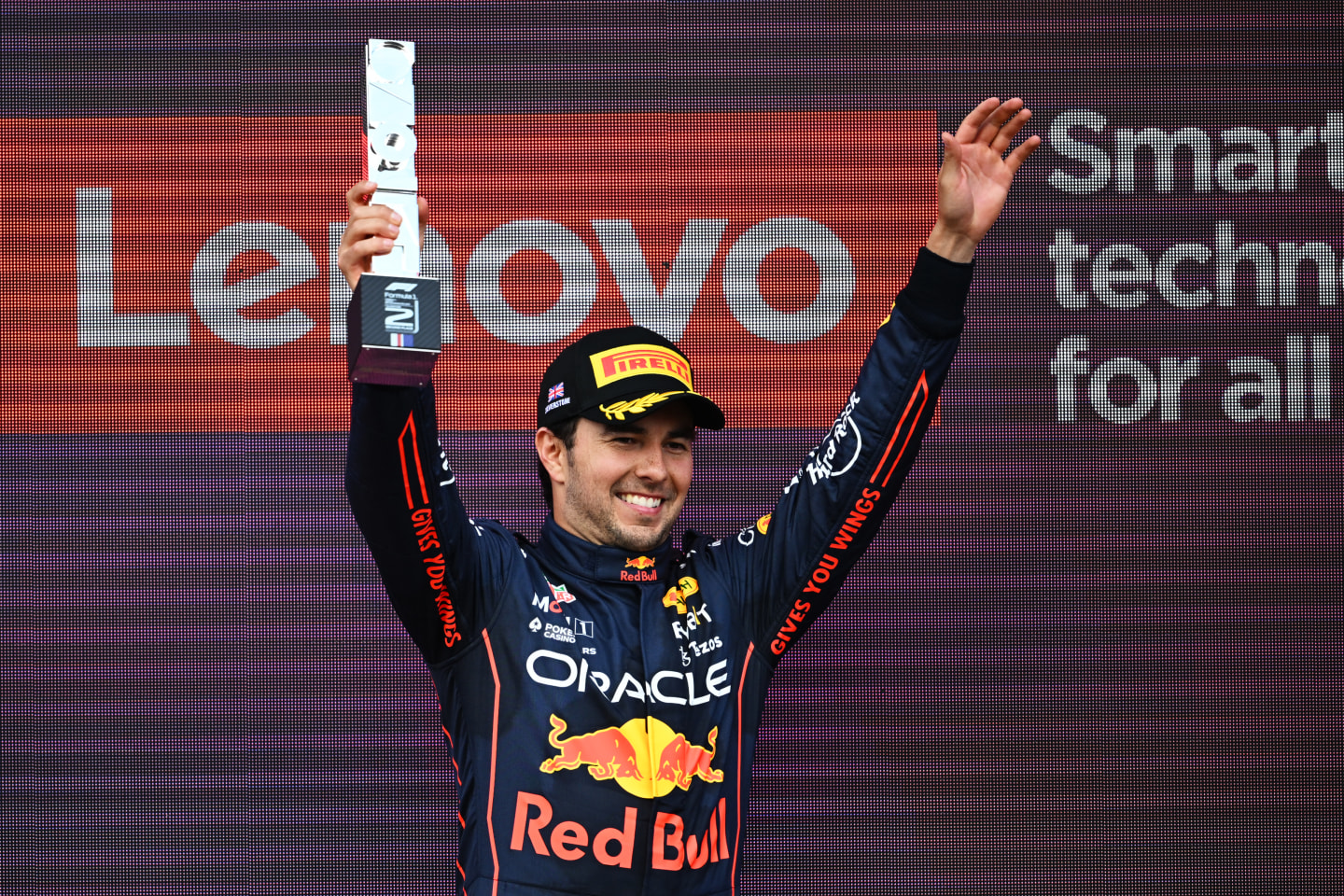 NORTHAMPTON, ENGLAND - JULY 03: Second placed Sergio Perez of Mexico and Oracle Red Bull Racing celebrates on the podium during the F1 Grand Prix of Great Britain at Silverstone on July 03, 2022 in Northampton, England. (Photo by Clive Mason/Getty Images)