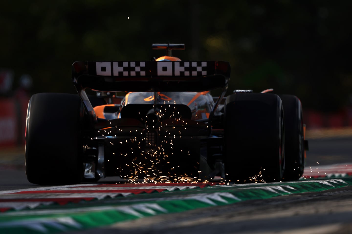 BUDAPEST, HUNGARY - JULY 29: Sparks fly behind Daniel Ricciardo of Australia driving the (3) McLaren MCL36 Mercedes during practice ahead of the F1 Grand Prix of Hungary at Hungaroring on July 29, 2022 in Budapest, Hungary. (Photo by Bryn Lennon - Formula 1/Formula 1 via Getty Images)