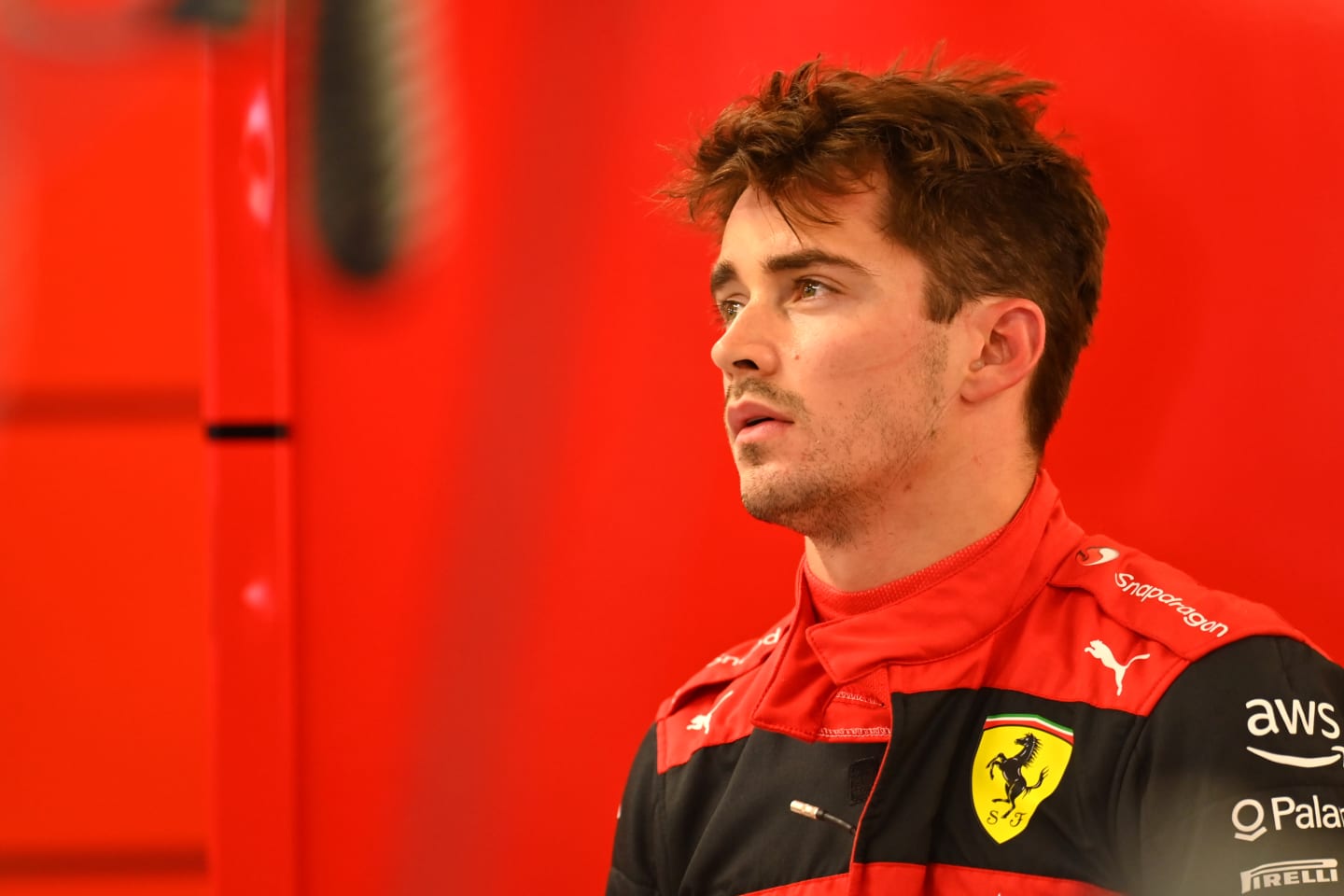 BUDAPEST, HUNGARY - JULY 30: Charles Leclerc of Monaco and Ferrari looks on in the garage during