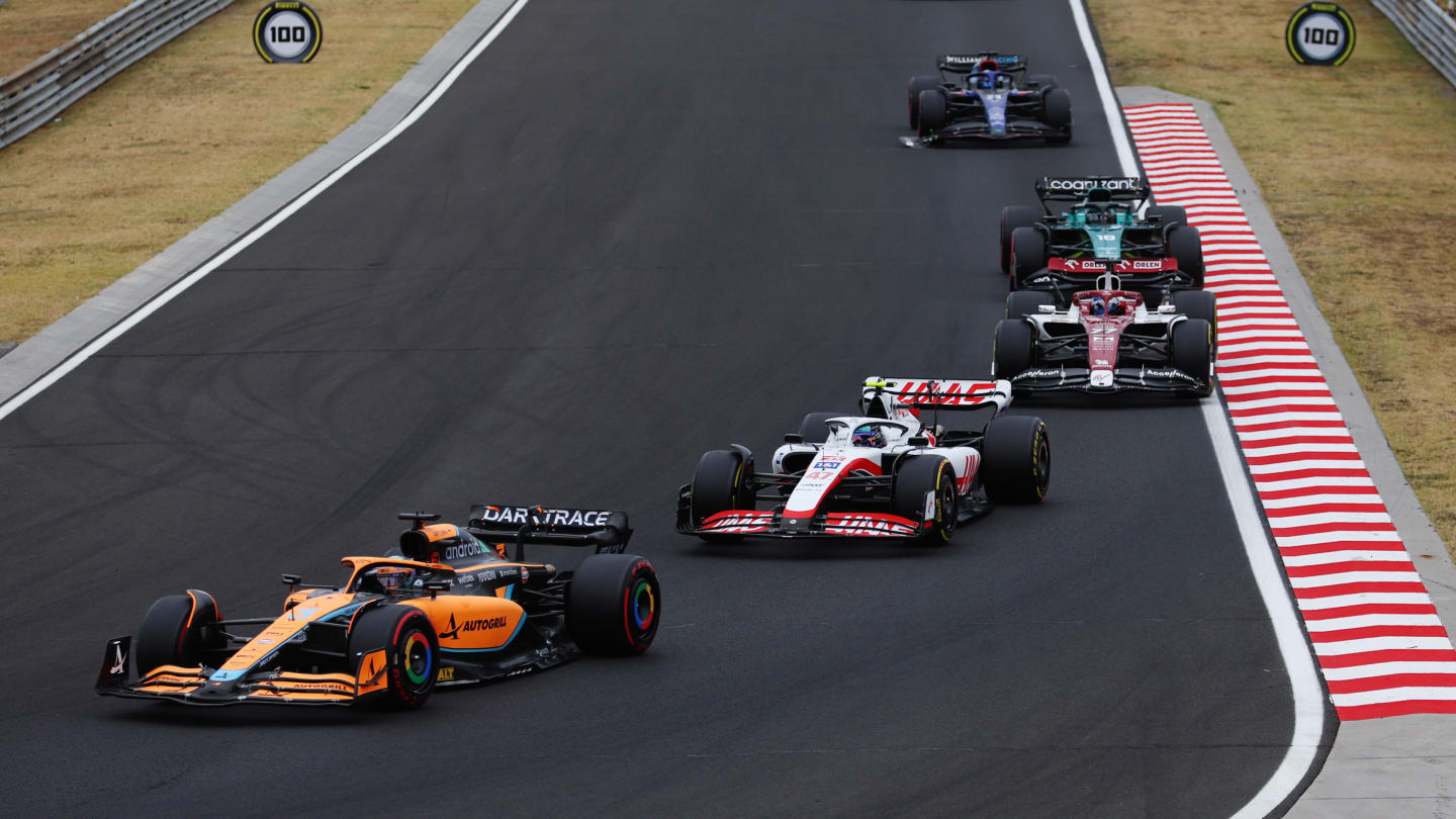 BUDAPEST, HUNGARY - JULY 31: Daniel Ricciardo of Australia driving the (3) McLaren MCL36 Mercedes leads Mick Schumacher of Germany driving the (47) Haas F1 VF-22 Ferrari during the F1 Grand Prix of Hungary at Hungaroring on July 31, 2022 in Budapest, Hungary. (Photo by Bryn Lennon - Formula 1/Formula 1 via Getty Images)