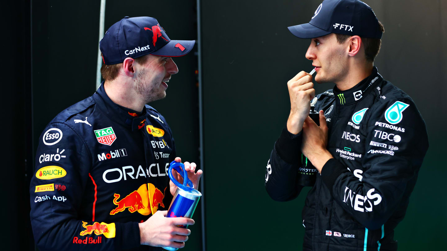 BUDAPEST, HUNGARY - JULY 31: Race winner Max Verstappen of the Netherlands and Oracle Red Bull Racing talks with Third placed George Russell of Great Britain and Mercedes in parc ferme during the F1 Grand Prix of Hungary at Hungaroring on July 31, 2022 in Budapest, Hungary. (Photo by Dan Istitene - Formula 1/Formula 1 via Getty Images)