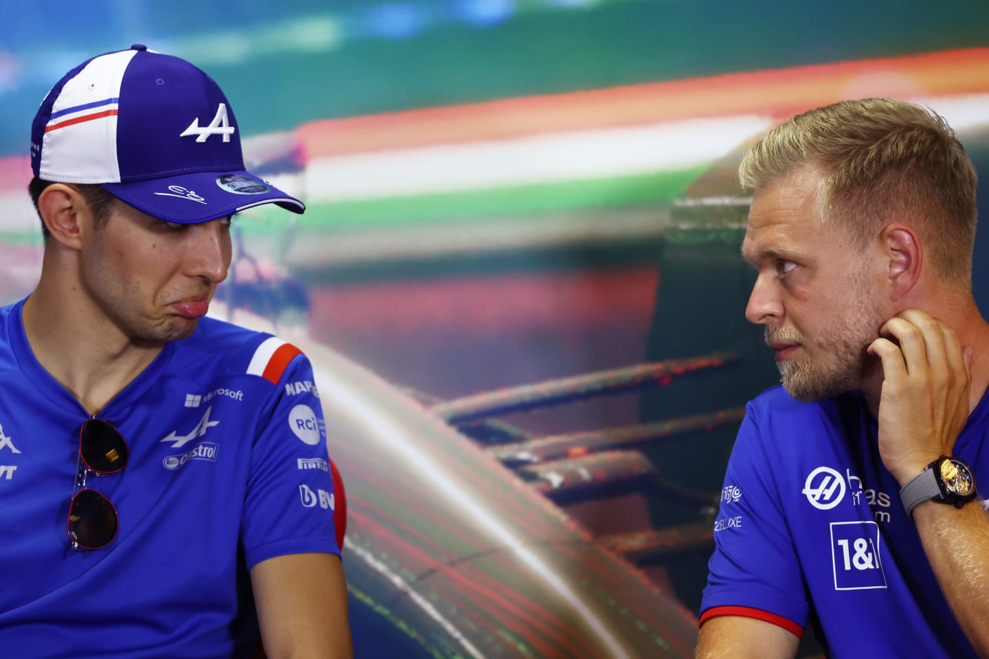 BUDAPEST, HUNGARY - JULY 28: Esteban Ocon of France and Alpine F1 and Kevin Magnussen of Denmark and Haas F1 talk in the Drivers Press Conference during previews ahead of the F1 Grand Prix of Hungary at Hungaroring on July 28, 2022 in Budapest, Hungary. (Photo by Bryn Lennon/Getty Images)