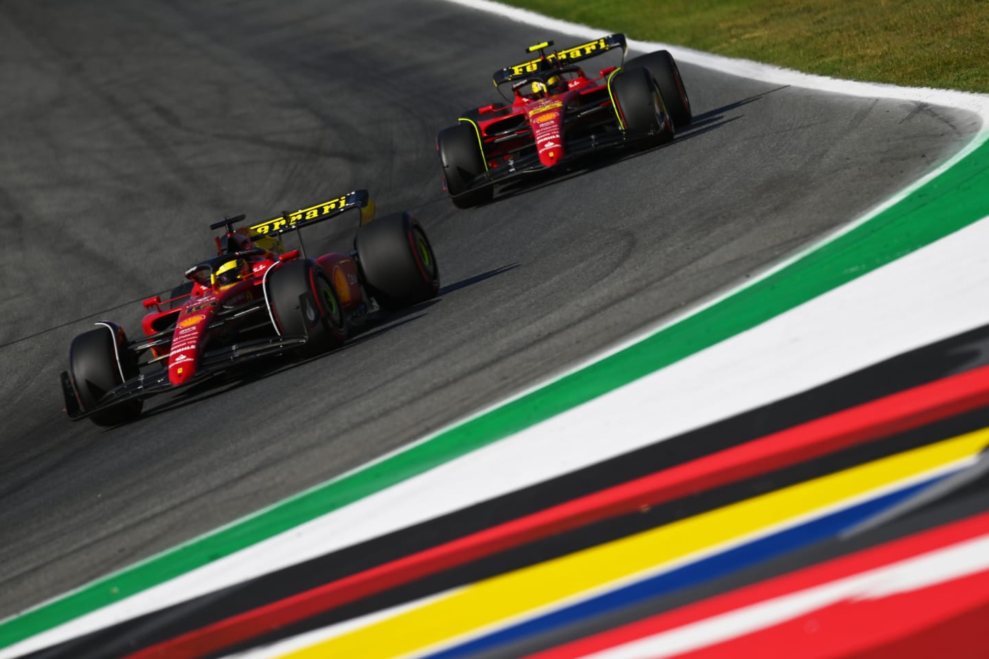 MONZA, ITALY - SEPTEMBER 10: Charles Leclerc of Monaco driving the (16) Ferrari F1-75 leads Carlos Sainz of Spain driving (55) the Ferrari F1-75 during qualifying ahead of the F1 Grand Prix of Italy at Autodromo Nazionale Monza on September 10, 2022 in Monza, Italy. (Photo by Dan Mullan/Getty Images)
