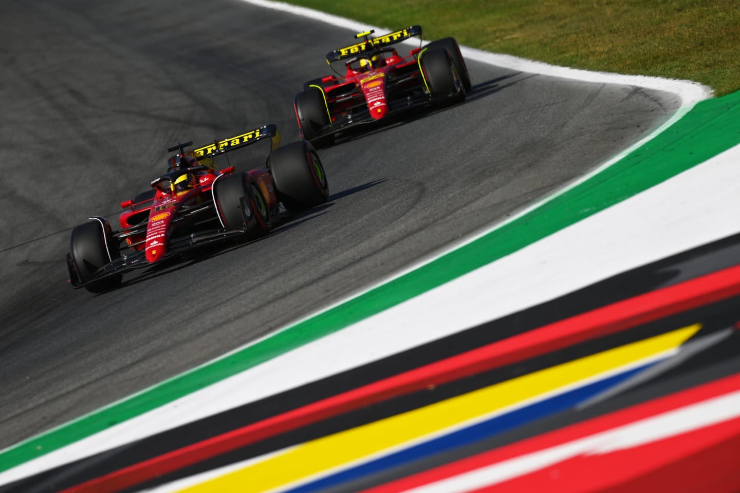 MONZA, ITALY - SEPTEMBER 10: Charles Leclerc of Monaco driving the (16) Ferrari F1-75 leads Carlos
