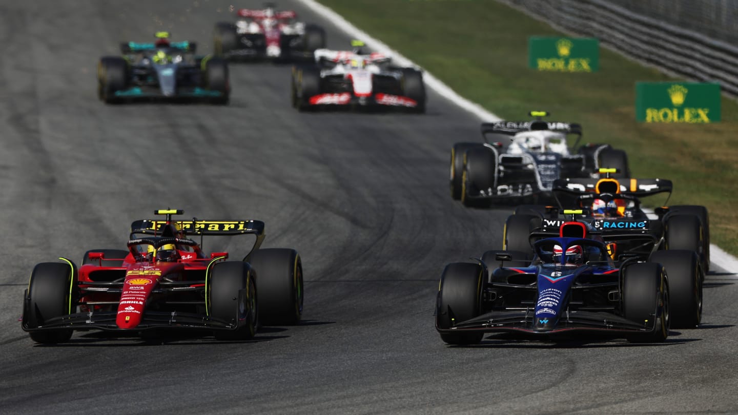 MONZA, ITALY - SEPTEMBER 11: Carlos Sainz of Spain driving (55) the Ferrari F1-75 leads Nicholas