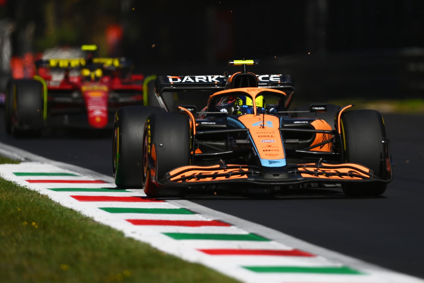 MONZA, ITALY - SEPTEMBER 11: Lando Norris of Great Britain driving the (4) McLaren MCL36 Mercedes leads Carlos Sainz of Spain driving (55) the Ferrari F1-75 during the F1 Grand Prix of Italy at Autodromo Nazionale Monza on September 11, 2022 in Monza, Italy. (Photo by Dan Mullan/Getty Images)
