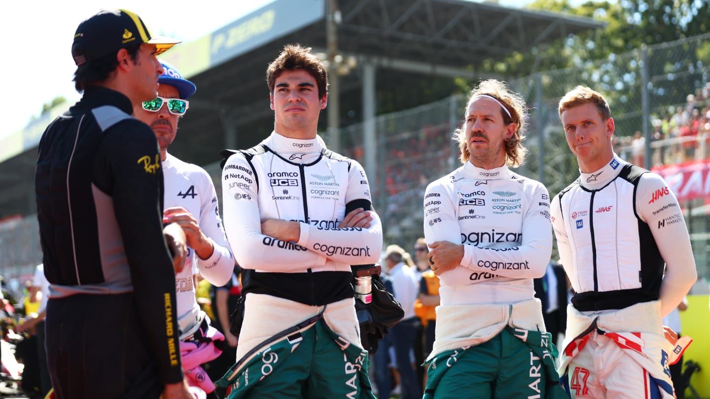 MONZA, ITALY - SEPTEMBER 11: Carlos Sainz of Spain and Ferrari, Fernando Alonso of Spain and Alpine