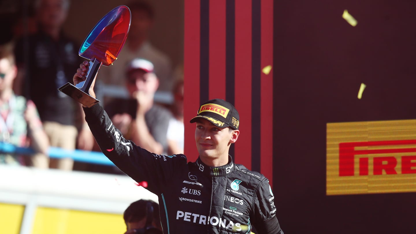 MONZA, ITALY - SEPTEMBER 11: Third placed George Russell of Great Britain and Mercedes celebrates on the podium during the F1 Grand Prix of Italy at Autodromo Nazionale Monza on September 11, 2022 in Monza, Italy. (Photo by Joe Portlock - Formula 1/Formula 1 via Getty Images)