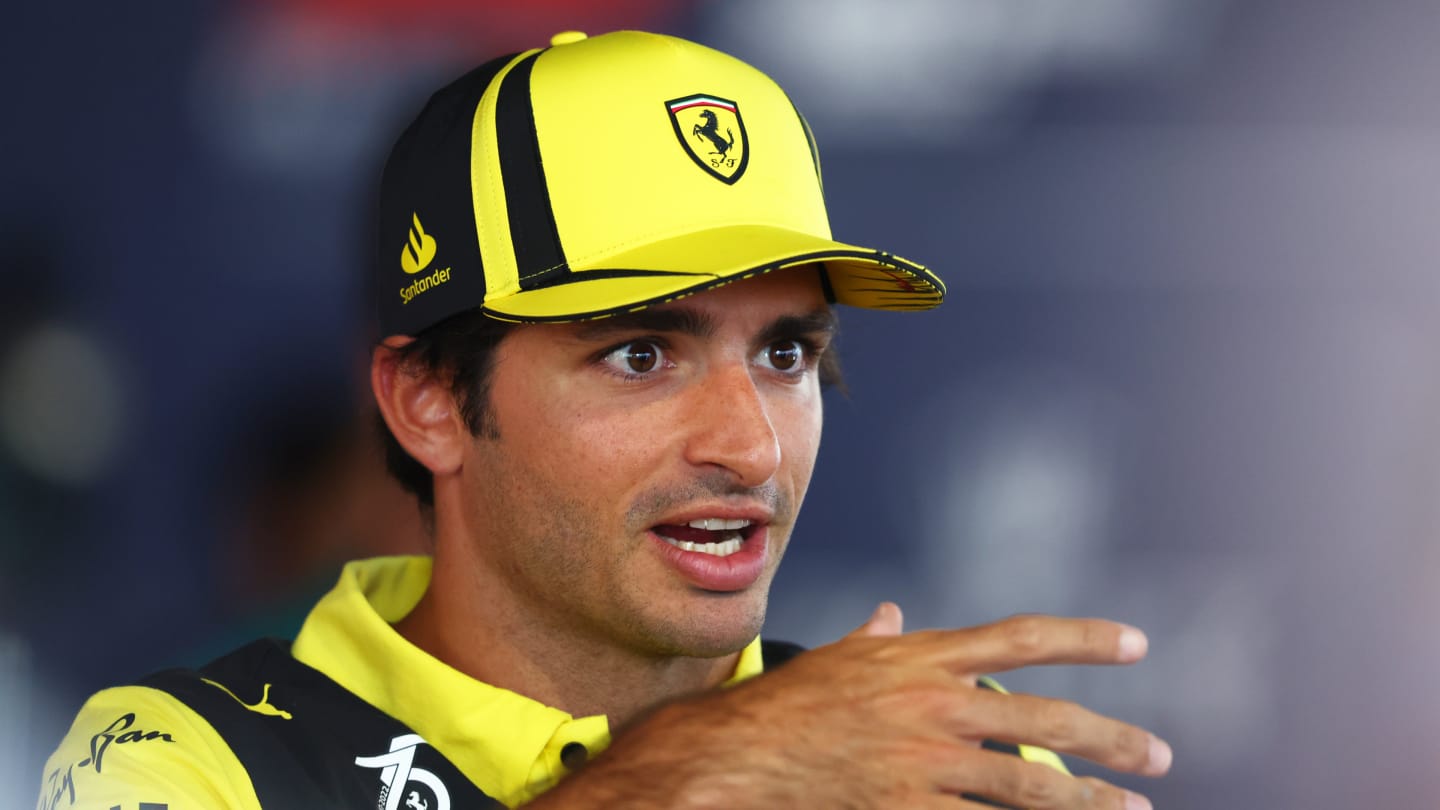 MONZA, ITALY - SEPTEMBER 08: Carlos Sainz of Spain and Ferrari talks to the media in the paddock