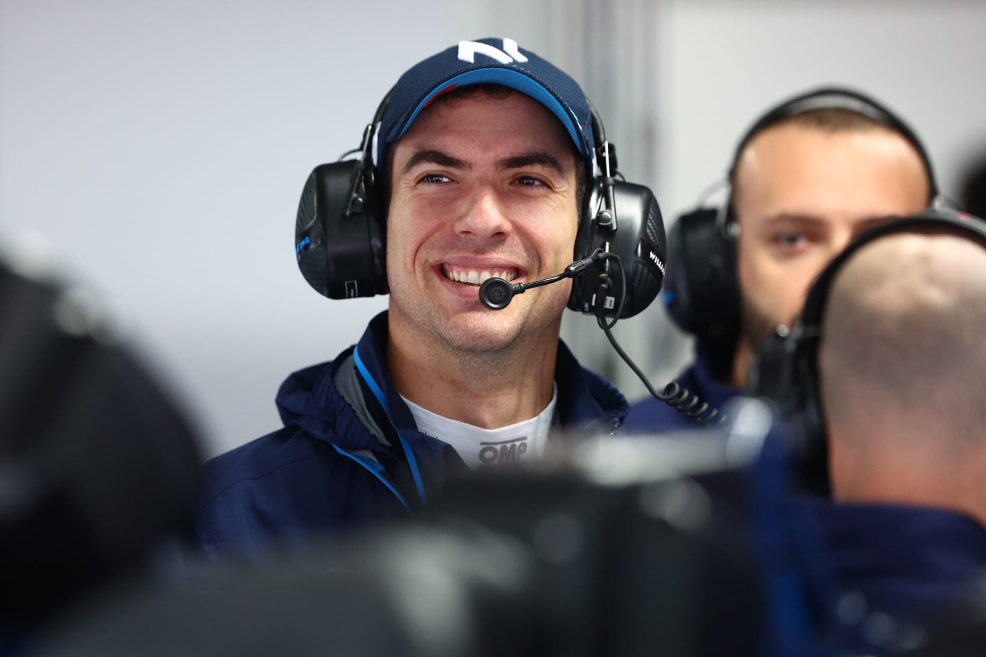 SUZUKA, JAPAN - OCTOBER 07: Nicholas Latifi of Canada and Williams looks on in the garage during practice ahead of the F1 Grand Prix of Japan at Suzuka International Racing Course on October 07, 2022 in Suzuka, Japan. (Photo by Clive Rose/Getty Images)