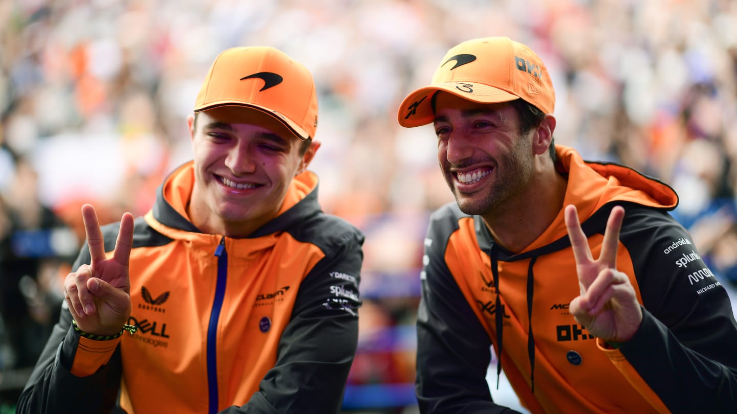 SUZUKA, JAPAN - OCTOBER 08: Daniel Ricciardo of Australia and McLaren and Lando Norris of Great Britain and McLaren pose for a photo on the fan stage prior to final practice ahead of the F1 Grand Prix of Japan at Suzuka International Racing Course on October 08, 2022 in Suzuka, Japan. (Photo by Mario Renzi - Formula 1/Formula 1 via Getty Images)