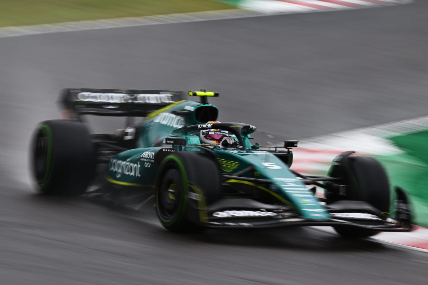 SUZUKA, JAPAN - OCTOBER 09: Sebastian Vettel of Germany driving the (5) Aston Martin AMR22 Mercedes