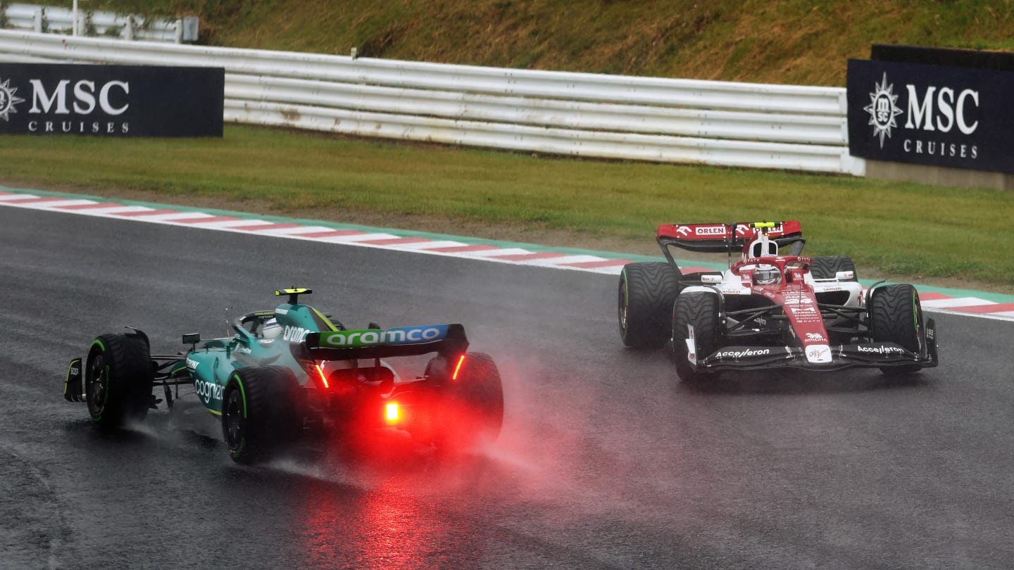 SUZUKA, JAPAN - OCTOBER 09: Zhou Guanyu of China driving the (24) Alfa Romeo F1 C42 Ferrari spins