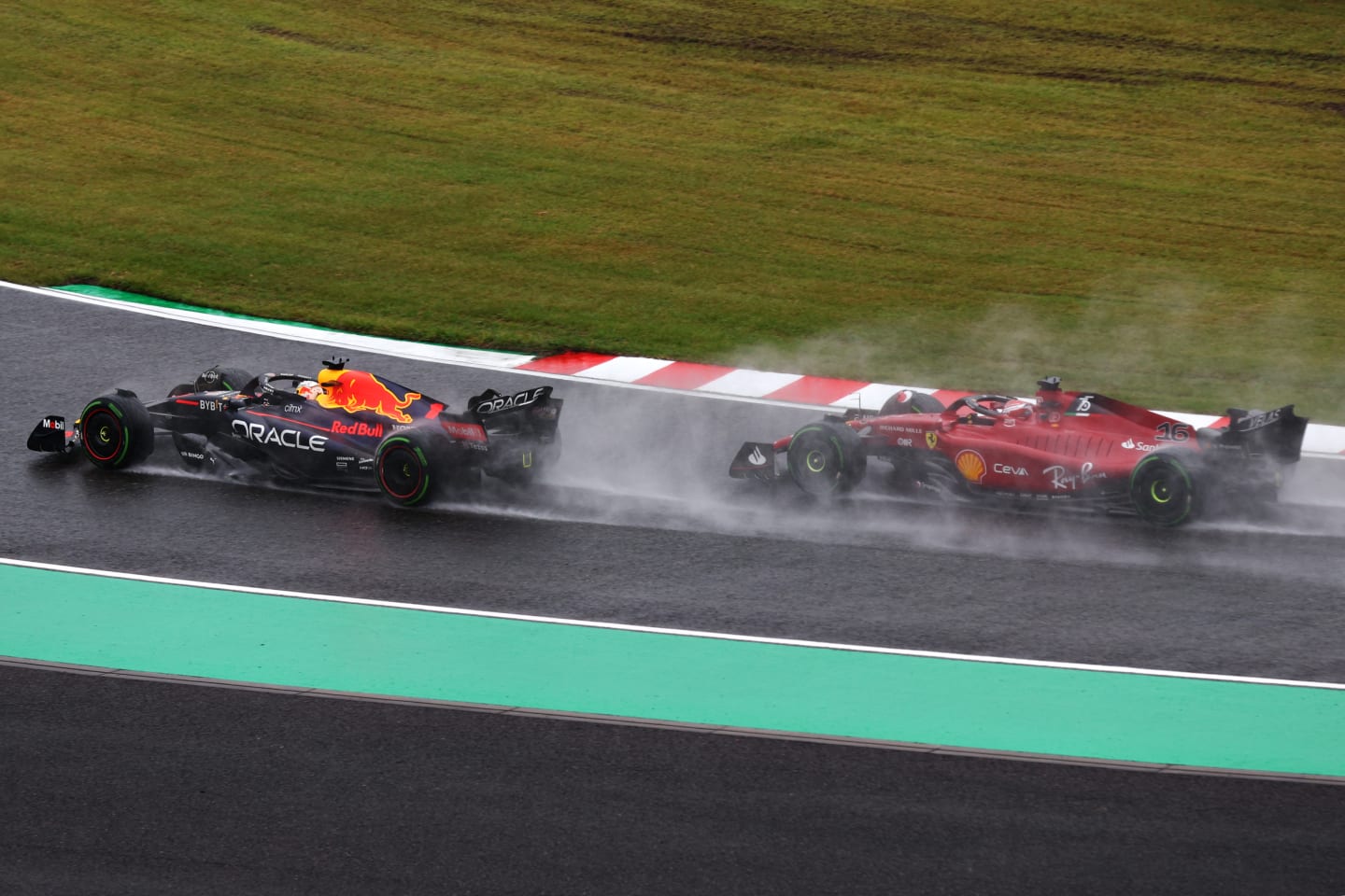SUZUKA, JAPAN - OCTOBER 09: Max Verstappen of the Netherlands driving the (1) Oracle Red Bull Racing RB18 leads Charles Leclerc of Monaco driving the (16) Ferrari F1-75 on lap one during the F1 Grand Prix of Japan at Suzuka International Racing Course on October 09, 2022 in Suzuka, Japan. (Photo by Clive Rose/Getty Images)