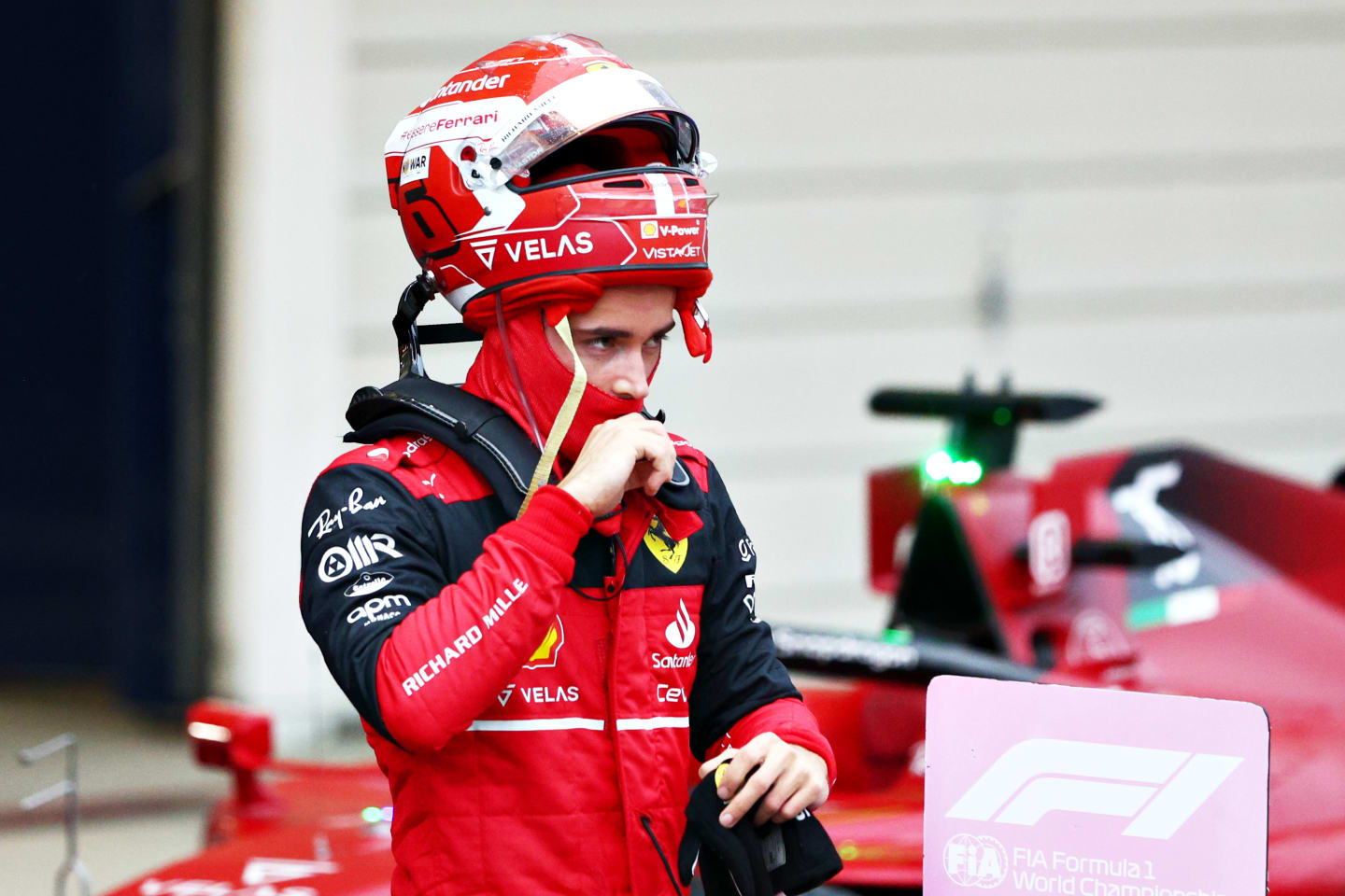 SUZUKA, JAPAN - OCTOBER 09: Third placed Charles Leclerc of Monaco and Ferrari looks on in parc ferme during the F1 Grand Prix of Japan at Suzuka International Racing Course on October 09, 2022 in Suzuka, Japan. (Photo by Clive Rose/Getty Images)