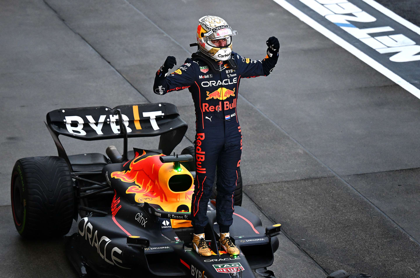 SUZUKA, JAPAN - OCTOBER 09: Race winner and 2022 F1 World Drivers Champion Max Verstappen of Netherlands and Oracle Red Bull Racing celebrates in parc ferme during the F1 Grand Prix of Japan at Suzuka International Racing Course on October 09, 2022 in Suzuka, Japan. (Photo by Clive Mason/Getty Images)